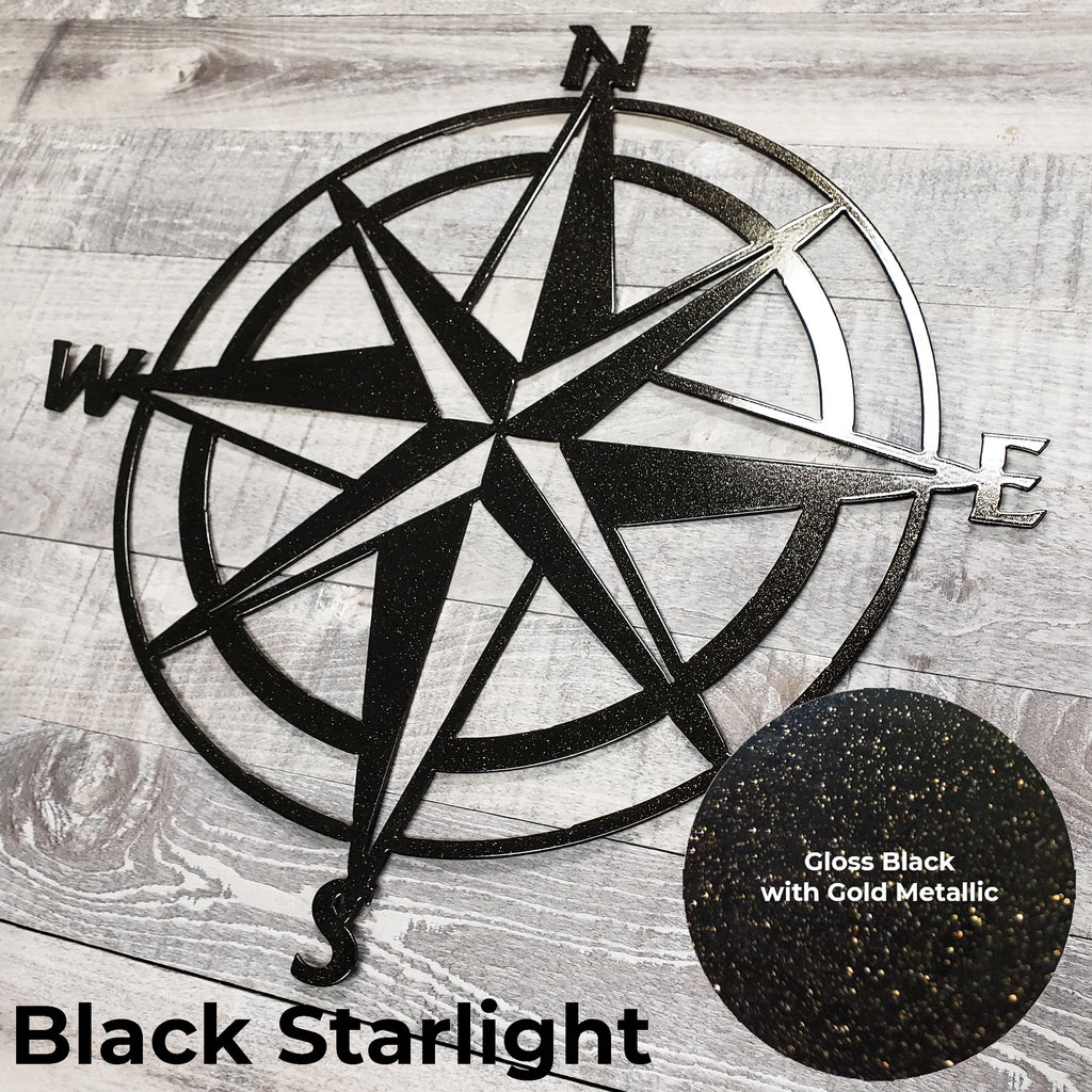 Black star-shaped compass wall decor on a wooden surface with 'Black Starlight' text.