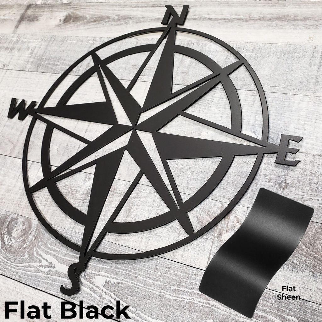 Black compass wall decor on a wooden surface with 'Flat Black' text.