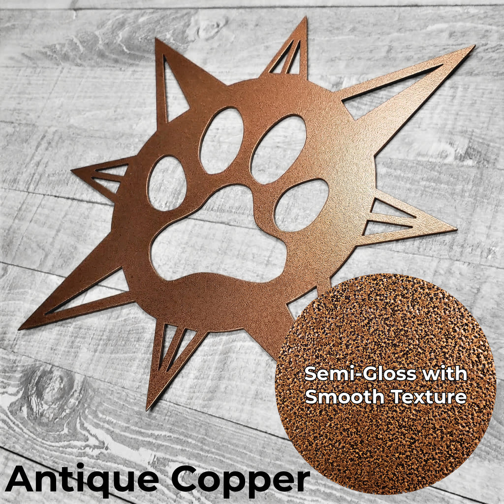 copper-colored compass rose with dog paw in center on a wooden background with a close-up of the color finish
