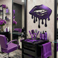 Salon interior with purple decor, including chairs and products, with a decorative wall piece.