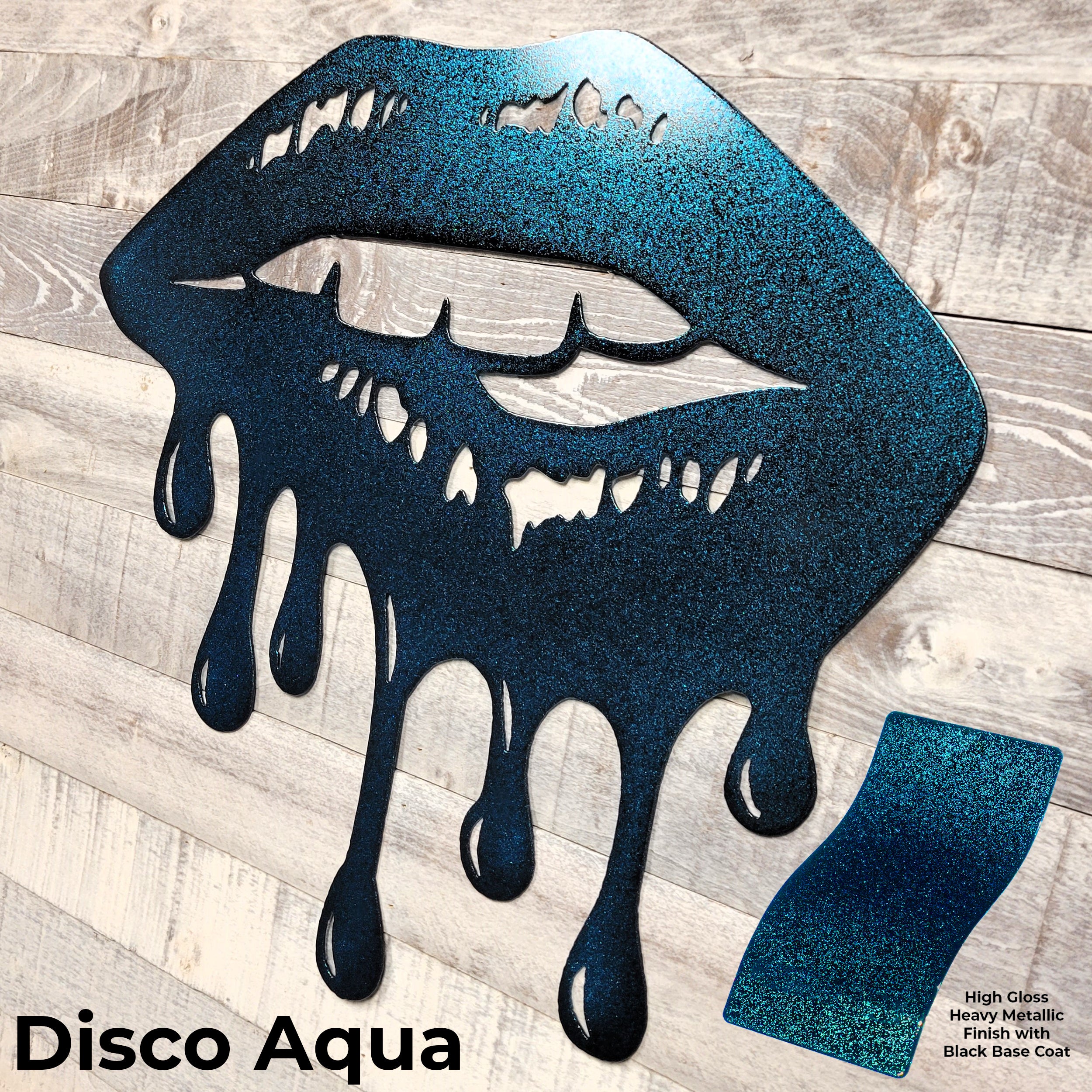 Metallic blue lips with a 'Disco Aqua' label on a wooden surface