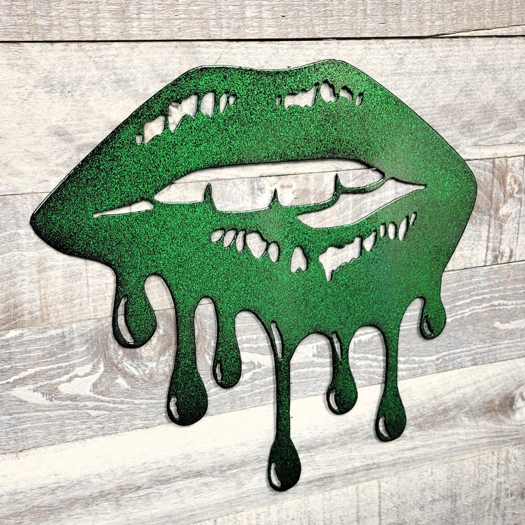 Green lips with melting effect on a wooden background
