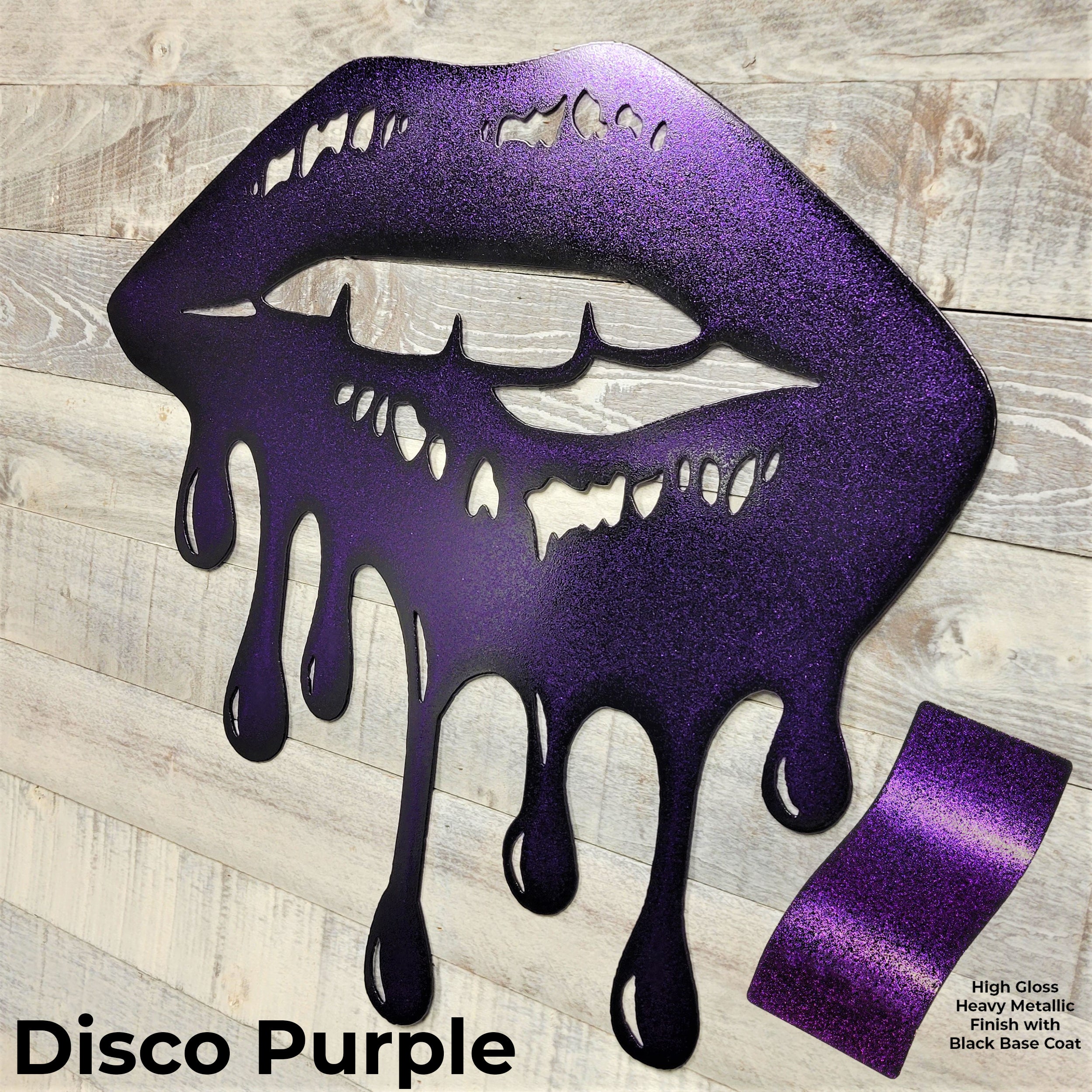 Metallic purple lips with a ribbon on a wooden background