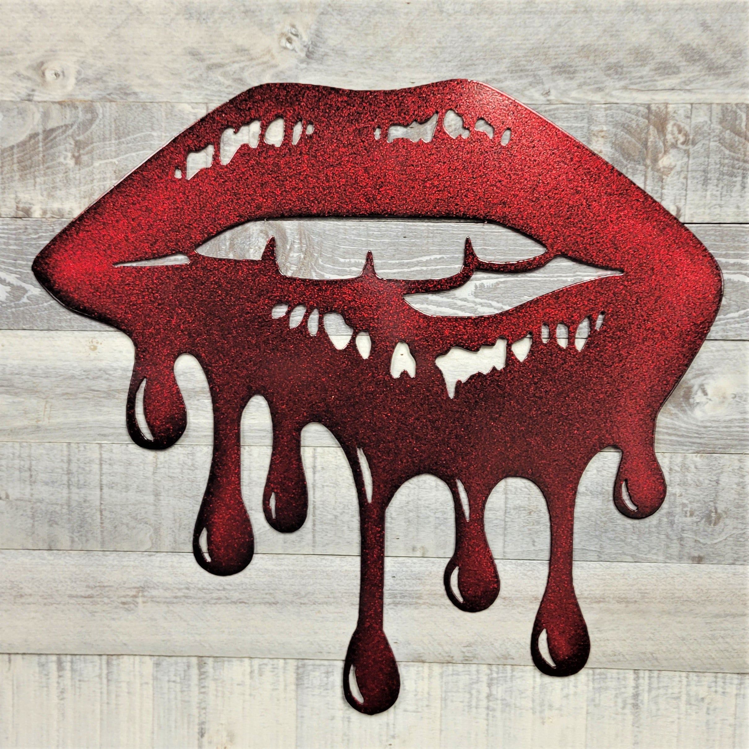 Red lips with dripping effect on a wooden background