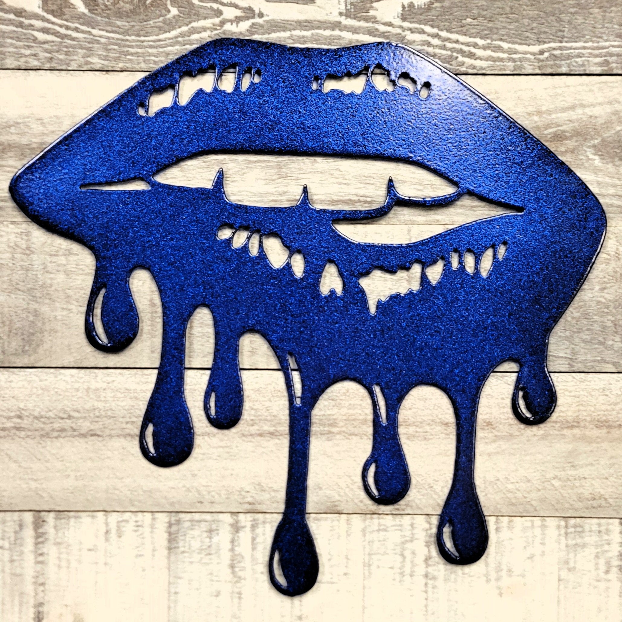 Blue lips with melting effect on a wooden surface