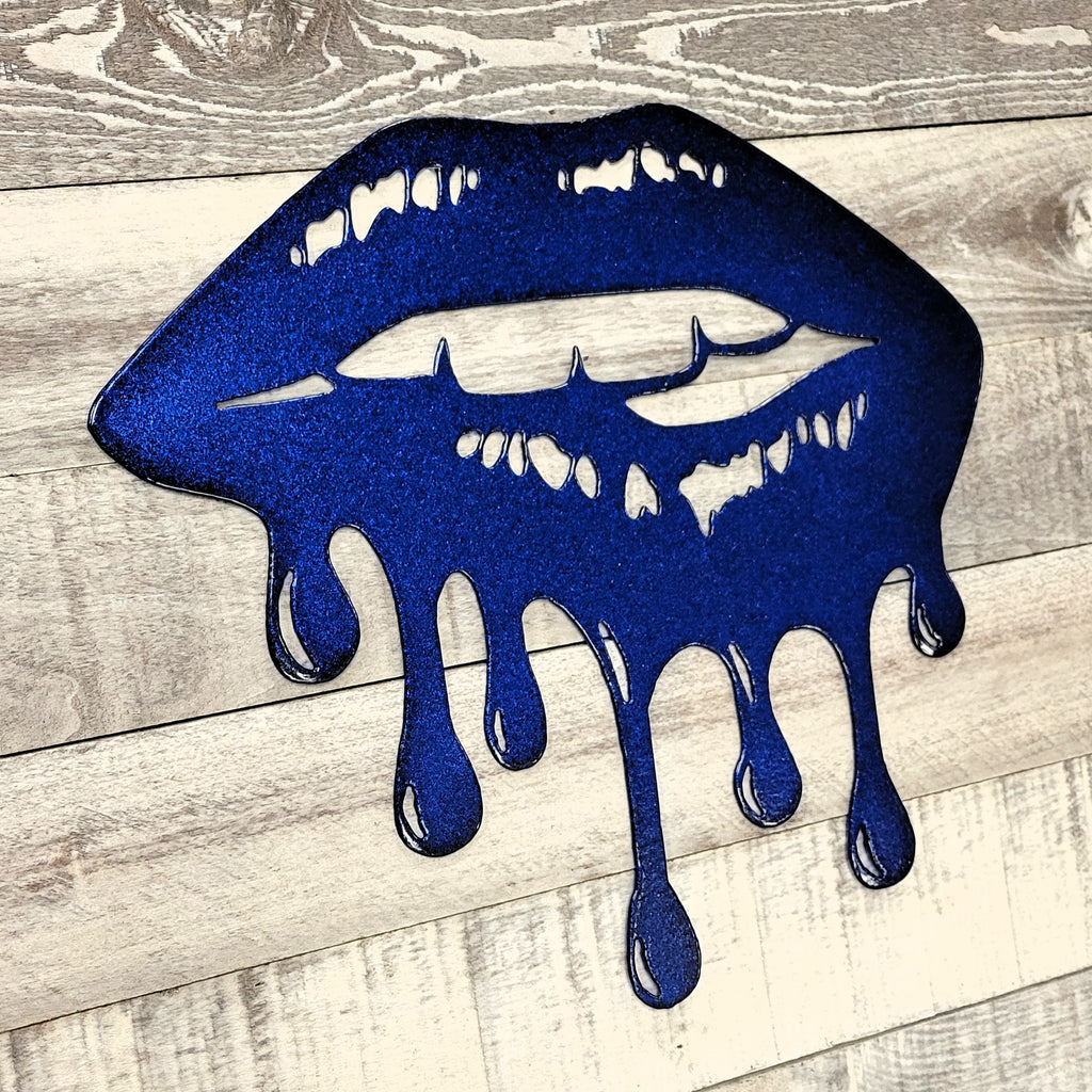 Blue lips with dripping effect on a wooden surface