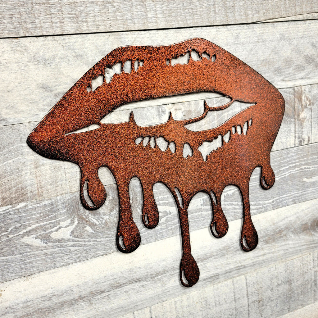 Metallic lips with a dripping effect on a wooden surface