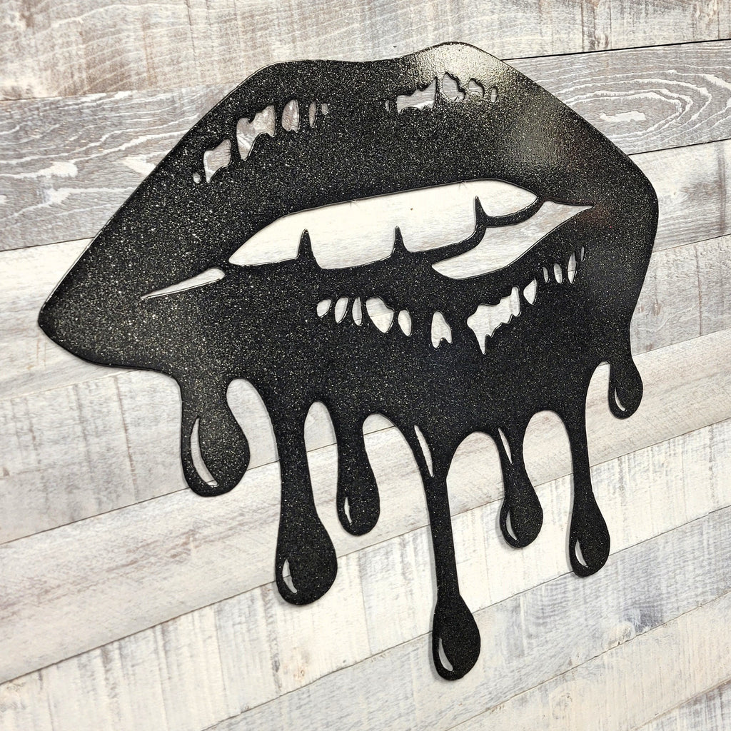 Black lips with dripping effect on a wooden background