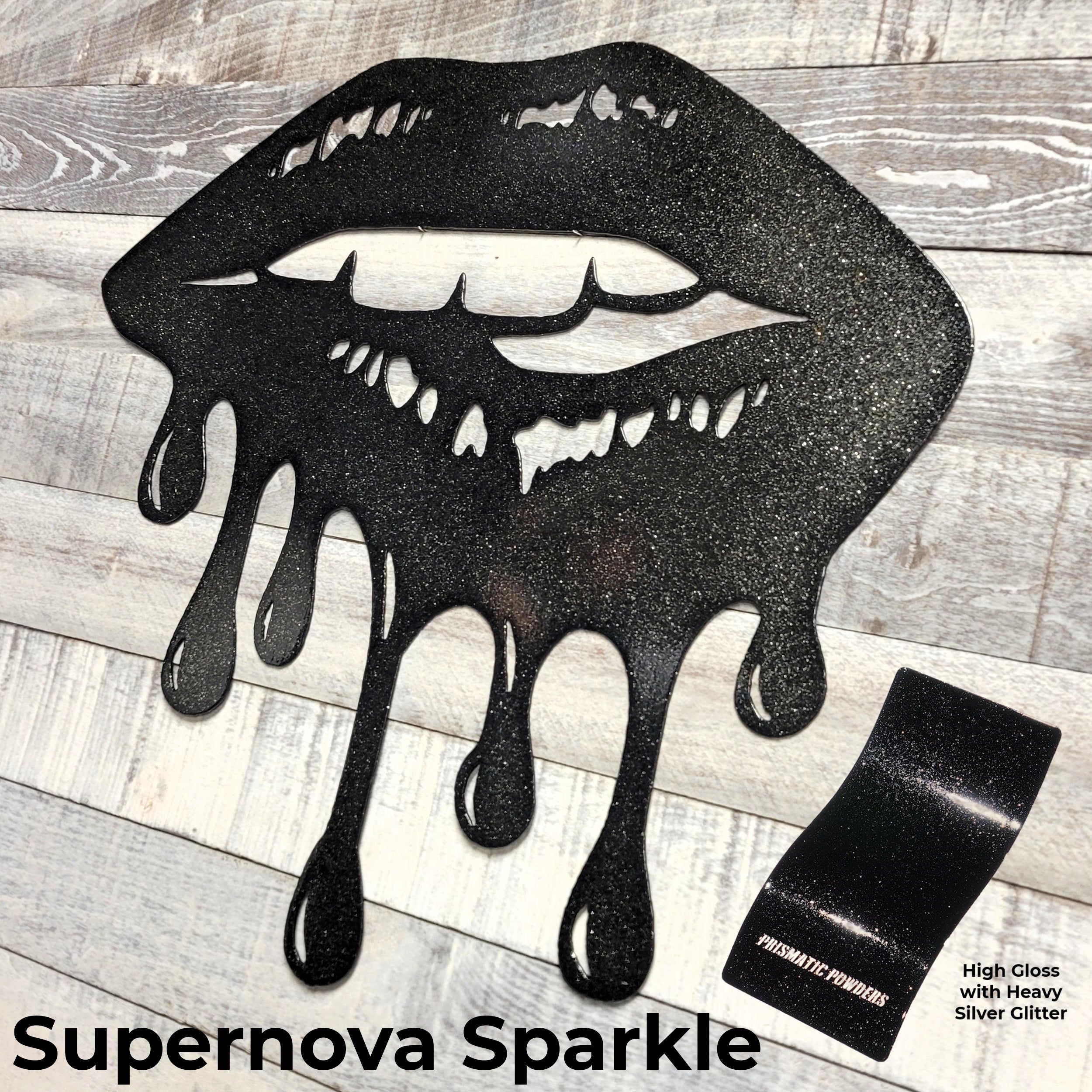 Black glittery lips with dripping effect on a wooden surface, labeled 'Supernova Sparkle'.