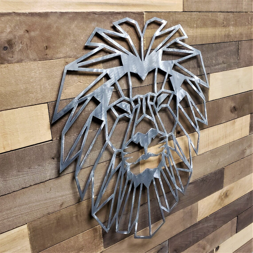 Metal lion head wall art on a wooden panel background
