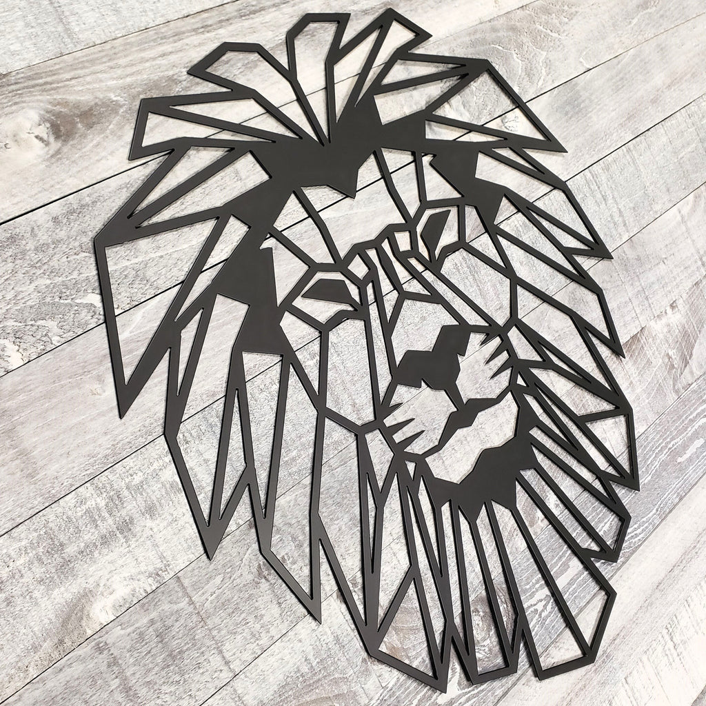 black geometric lion wall art on a wooden floor