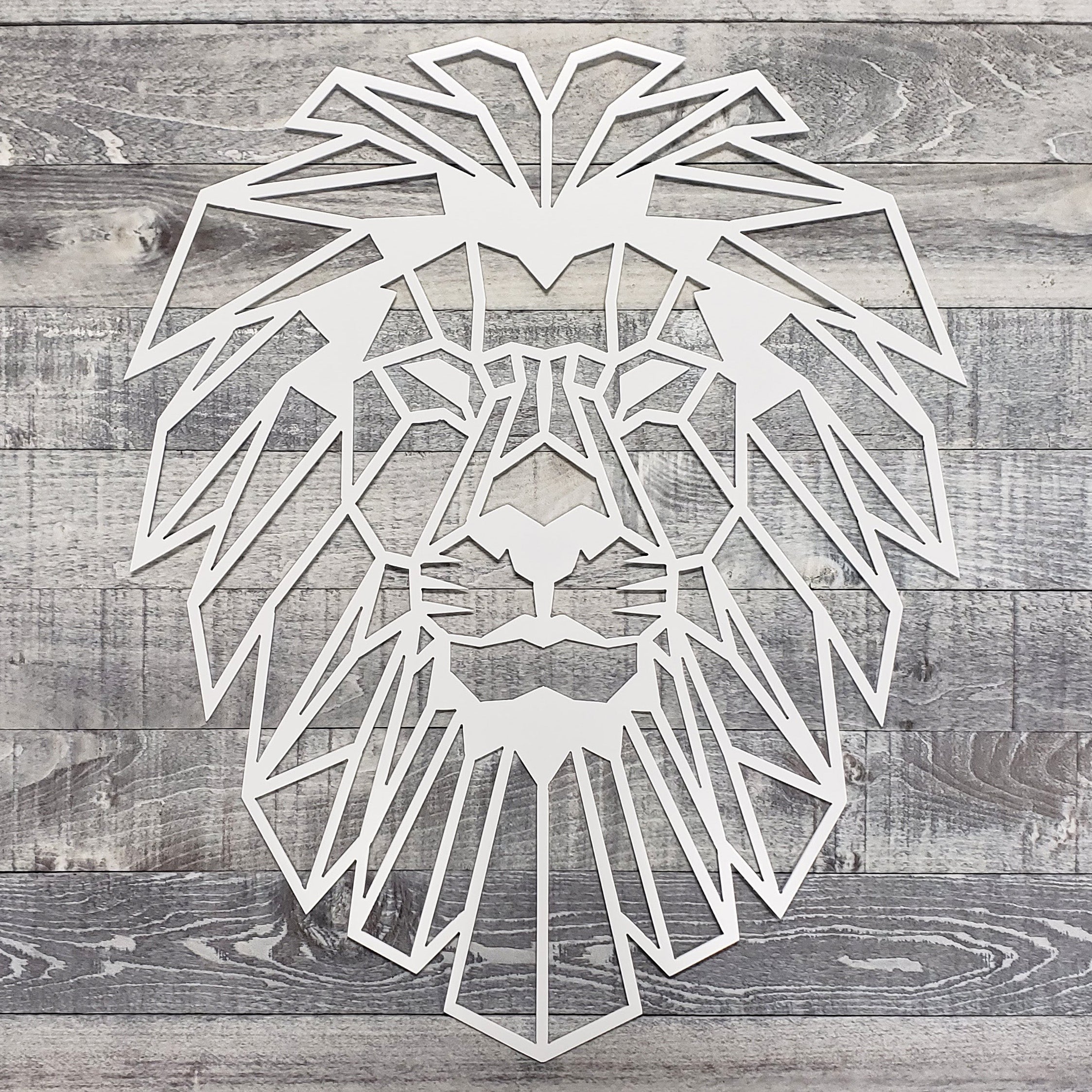 Geometric lion head design on a wooden background