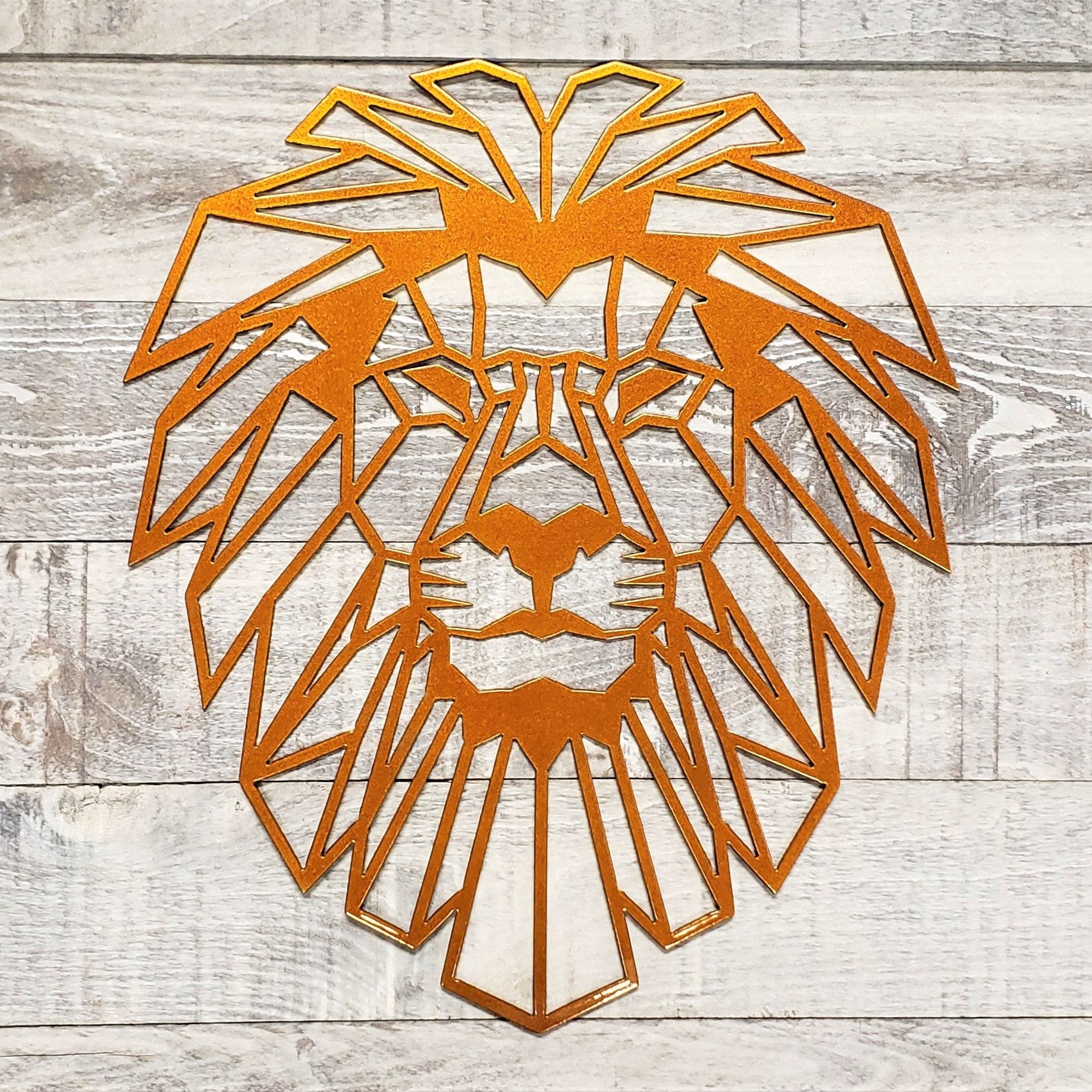 Geometric lion head wall art on a wooden background