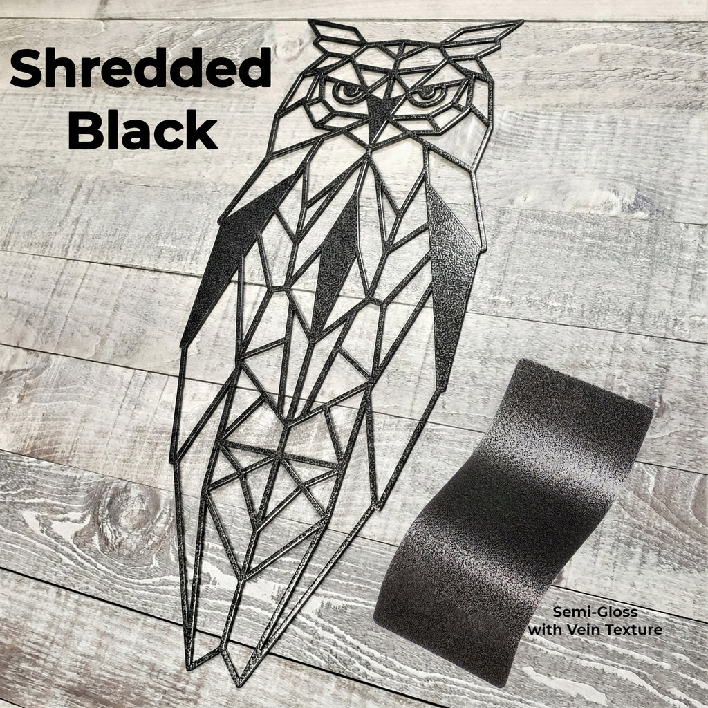 black geometric owl metal wall art on a wooden background with color panel 
