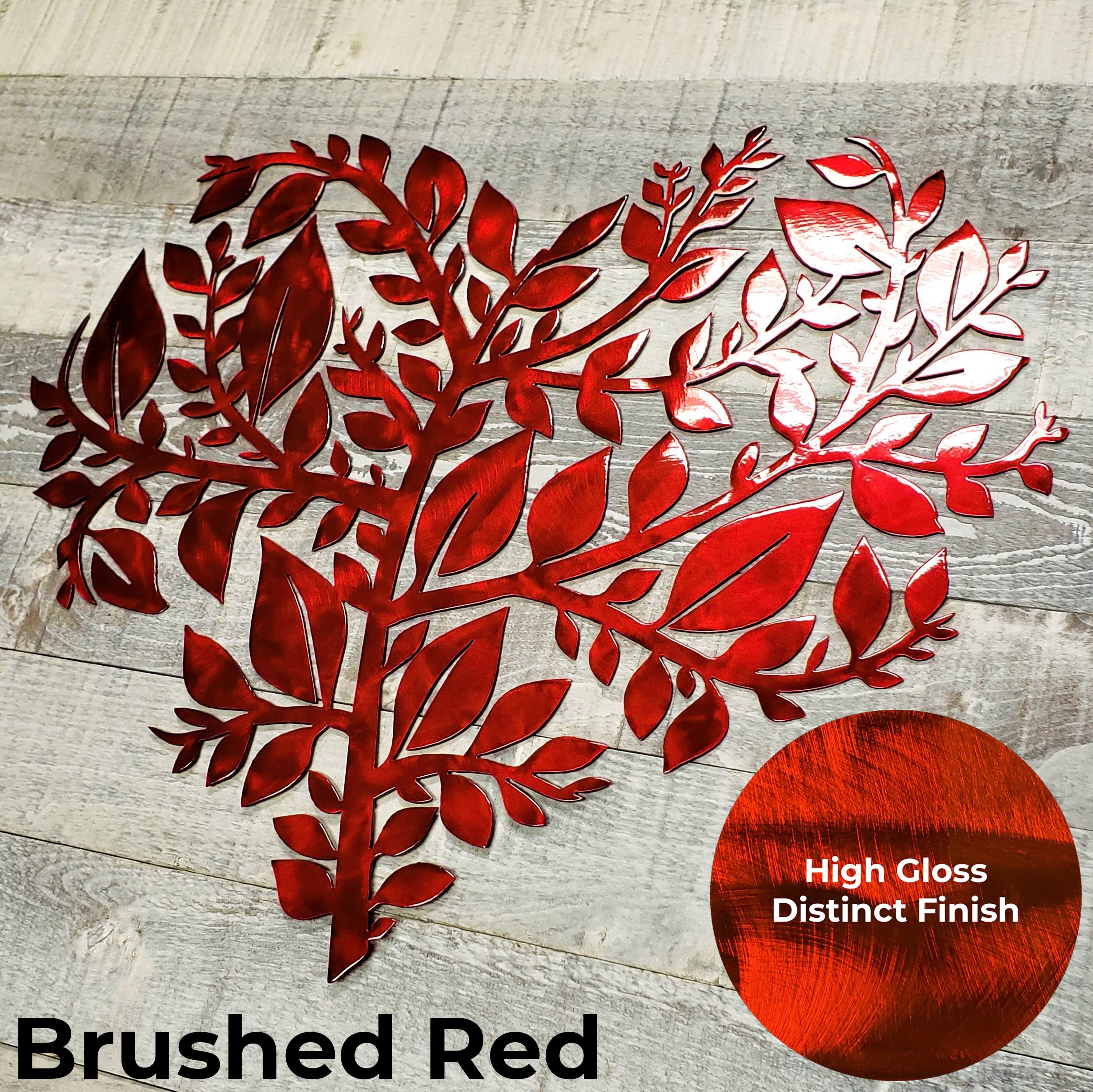 Metallic red leaf design on a wooden surface with 'Brushed Red' text and color swatch.