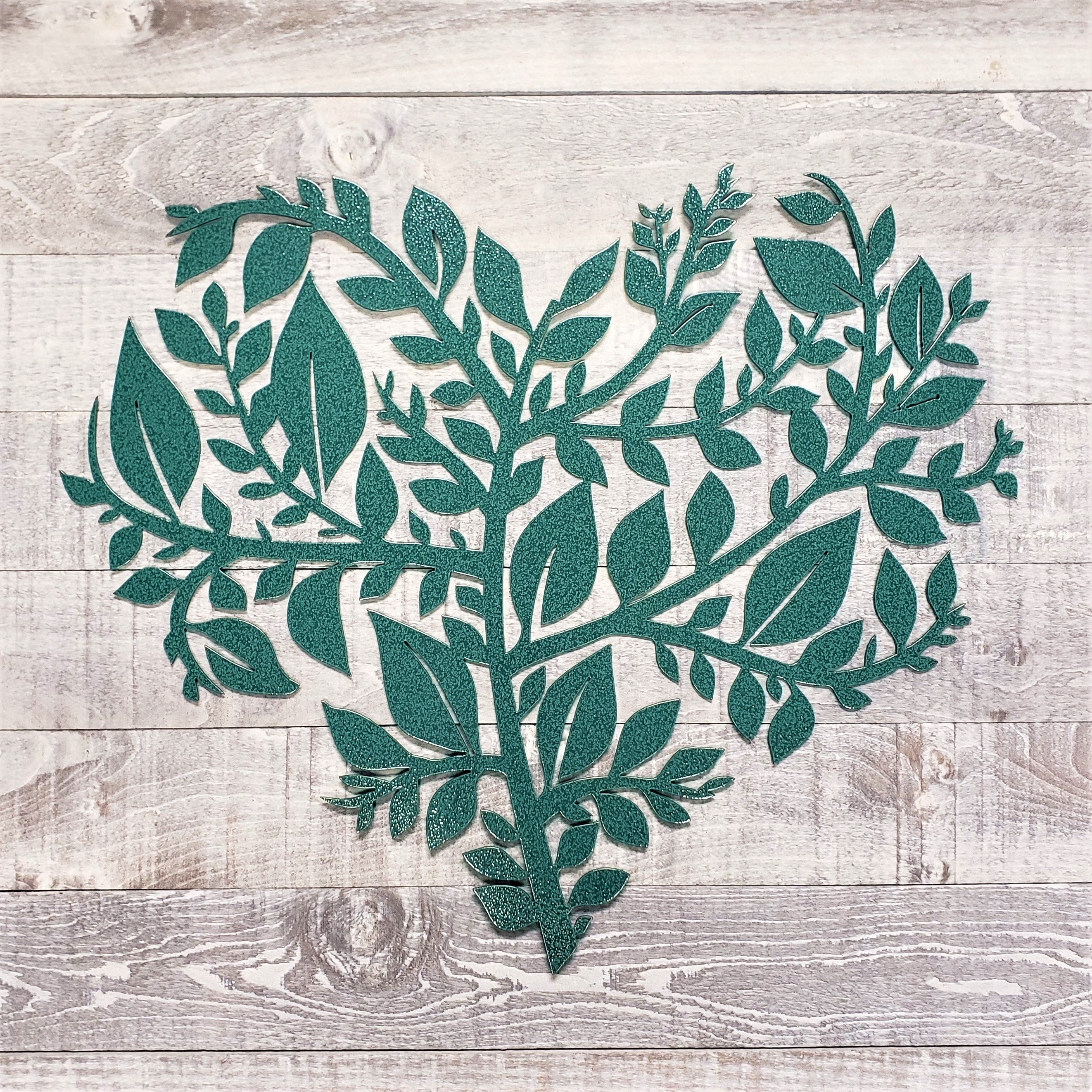 green leafy heart-shaped cutout on a wooden background