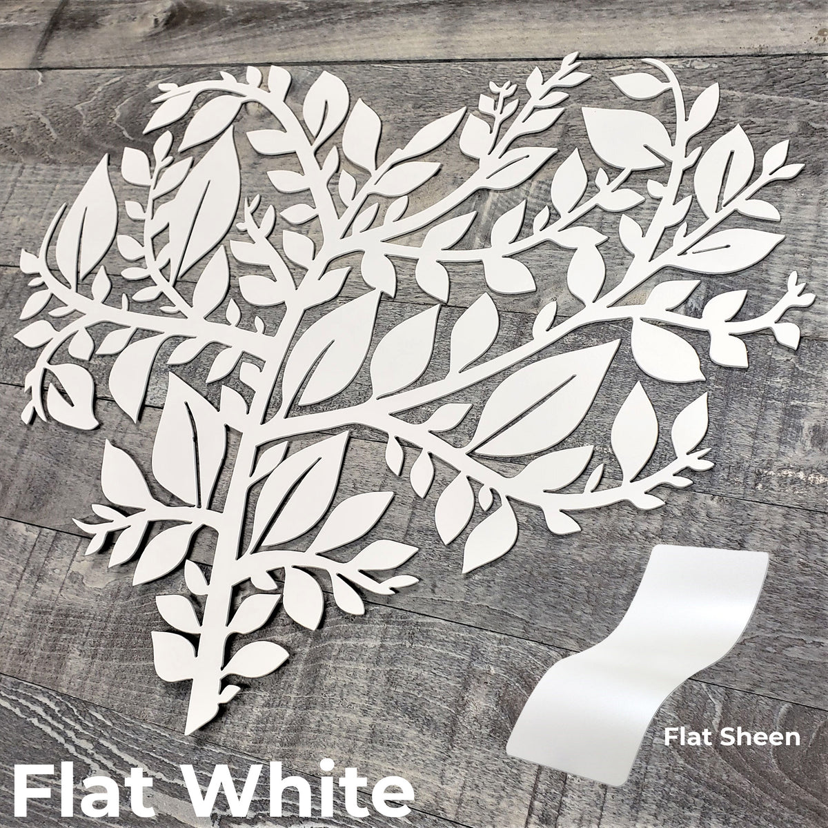 White leafy branch design on a wooden surface with 'Flat White' text.