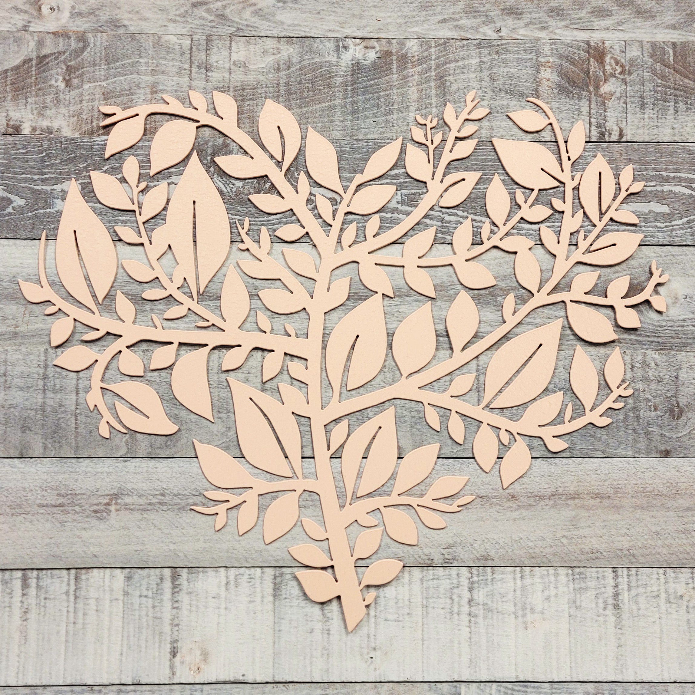 Wooden leaf and branch wall decor on a wooden background