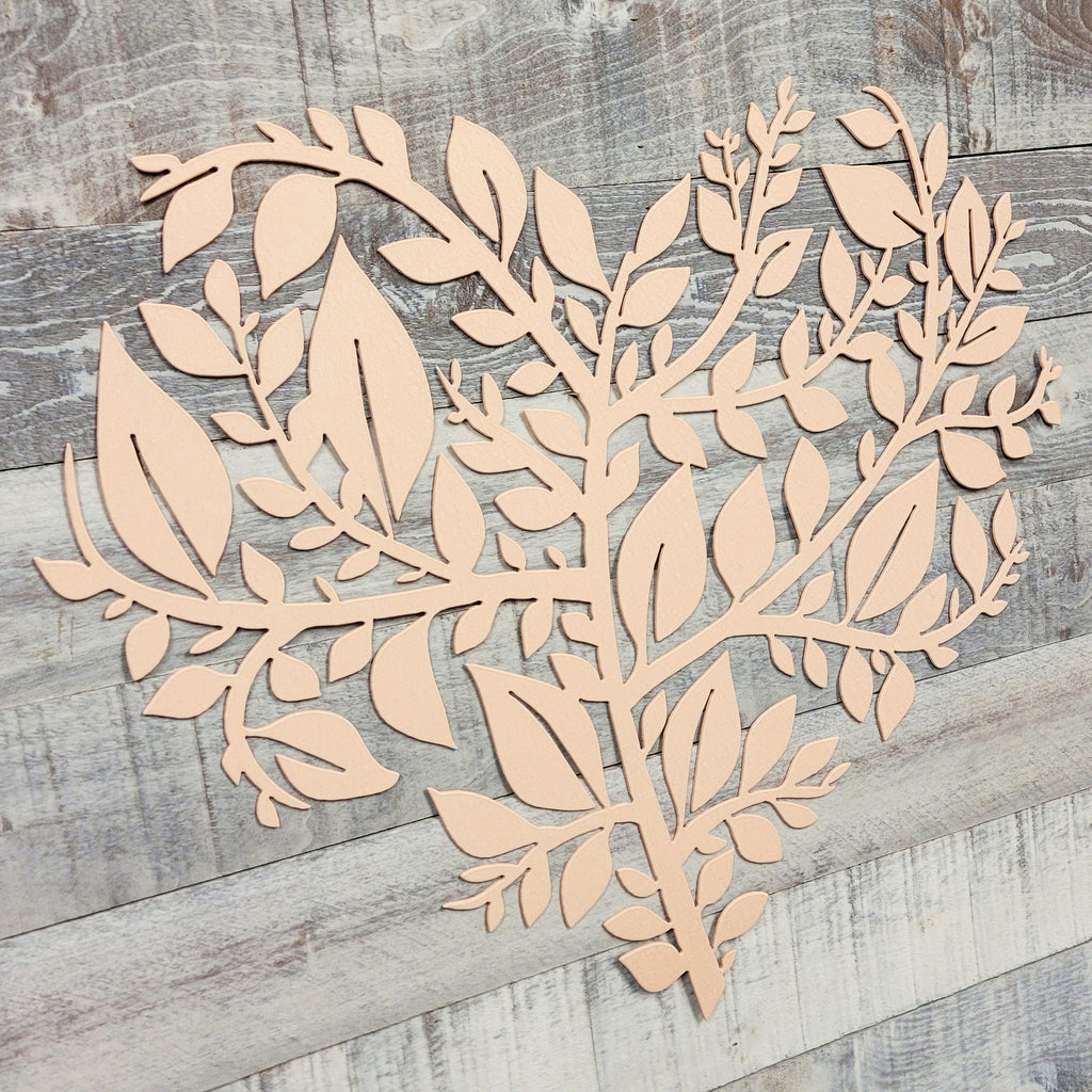 Wooden leaf and branch design on a wooden surface