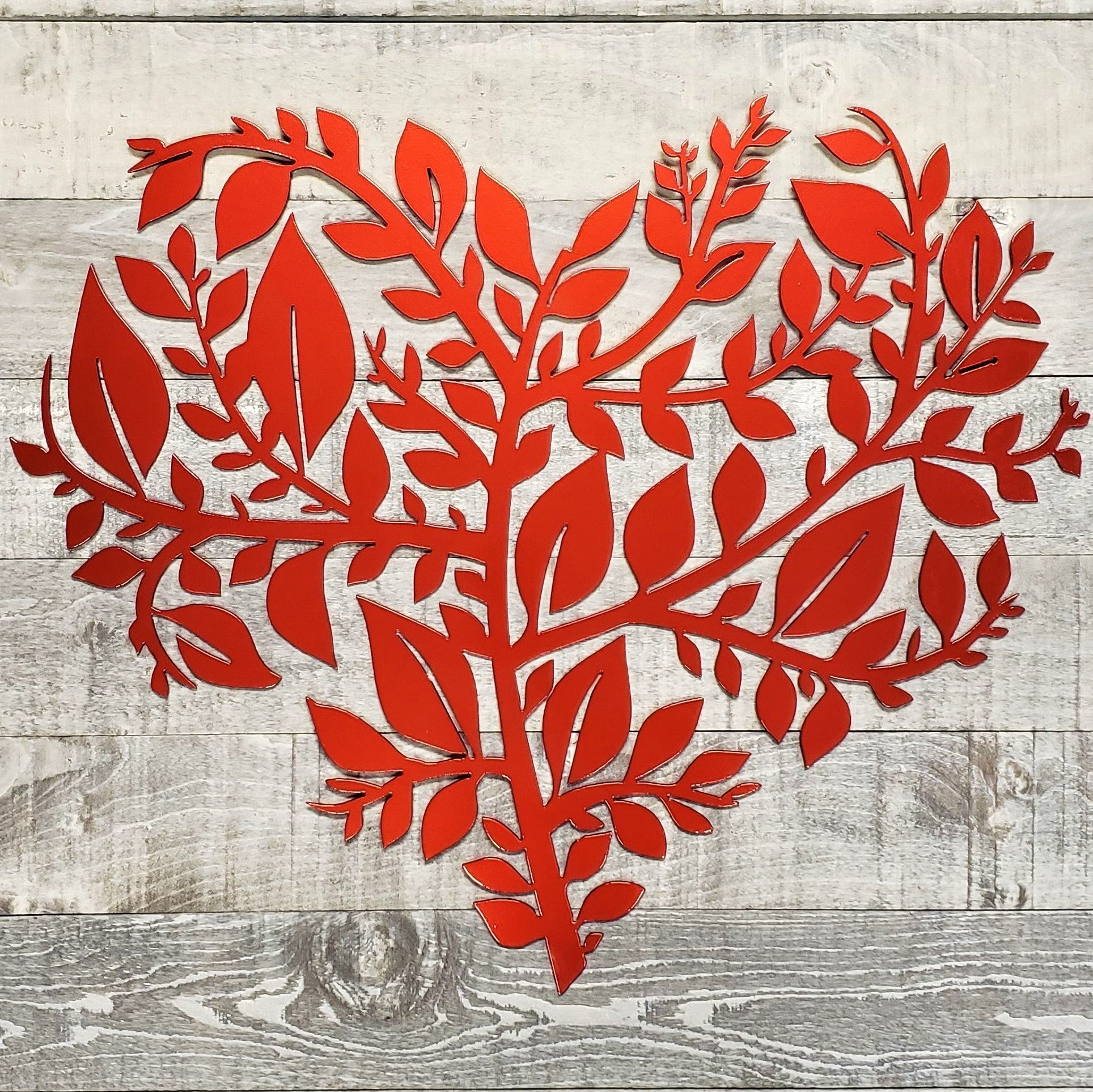 Red floral design on a wooden background