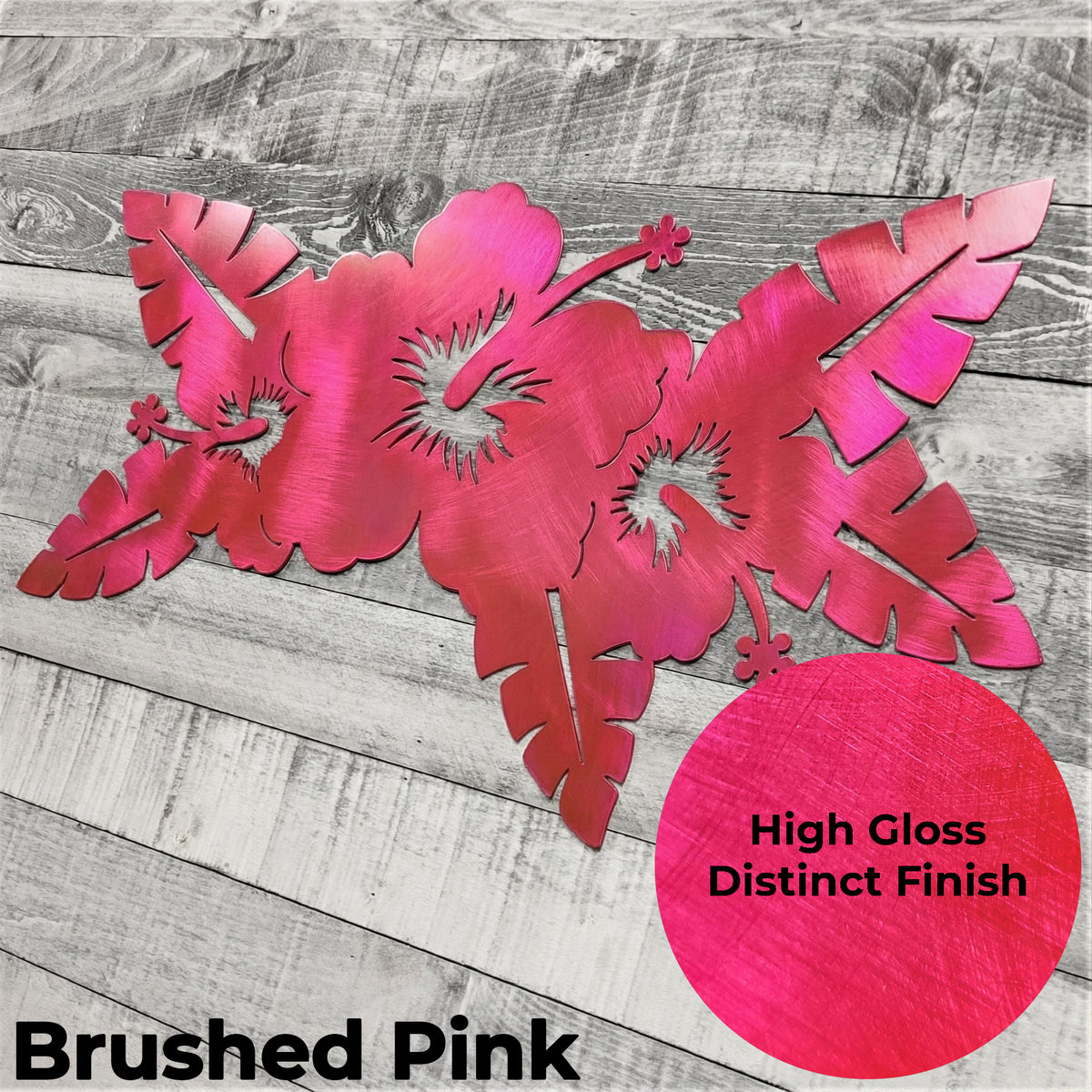 Decorative metal flower wall art with a high gloss finish on a wooden surface