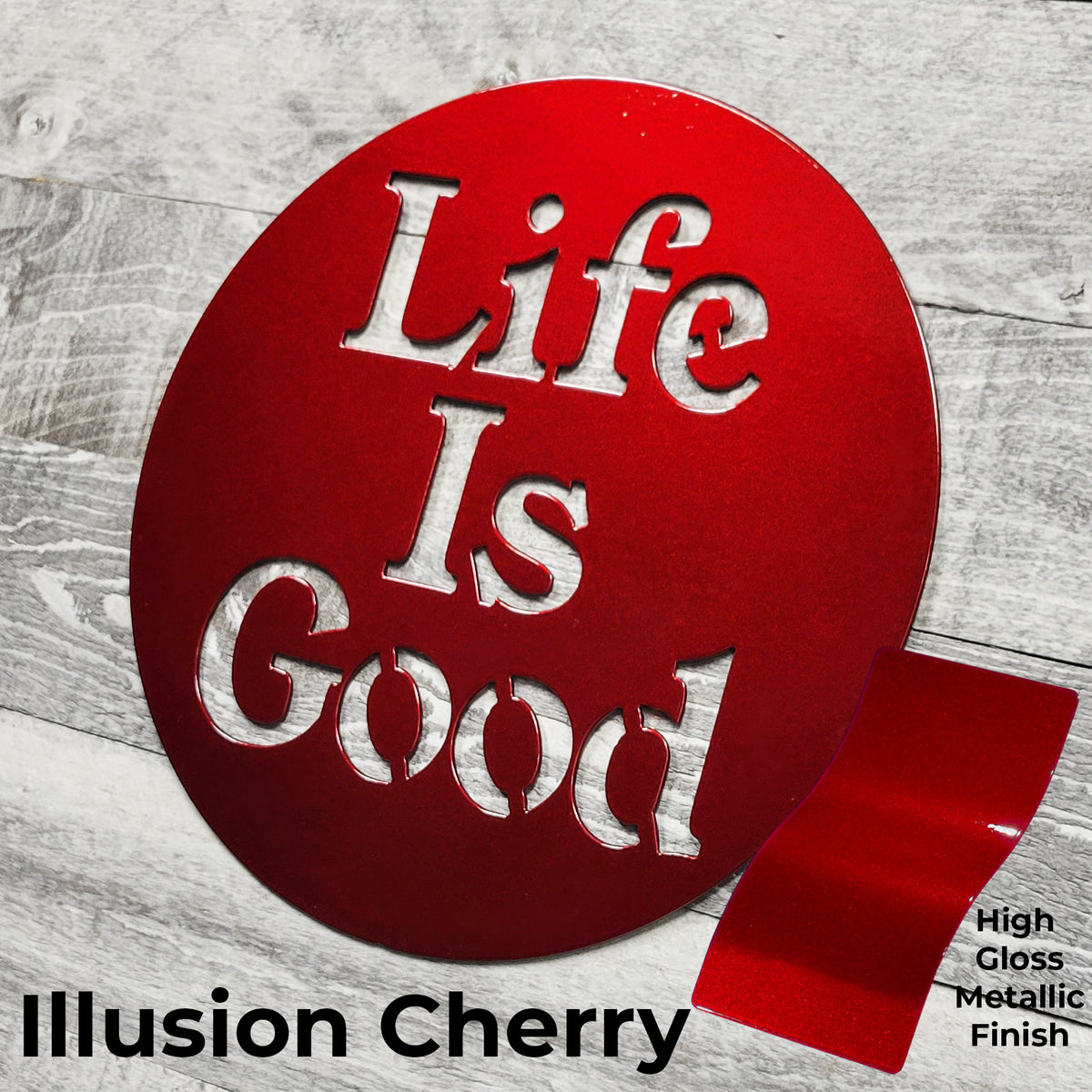 Red circular sign with 'Life Is Good' text on a wooden surface