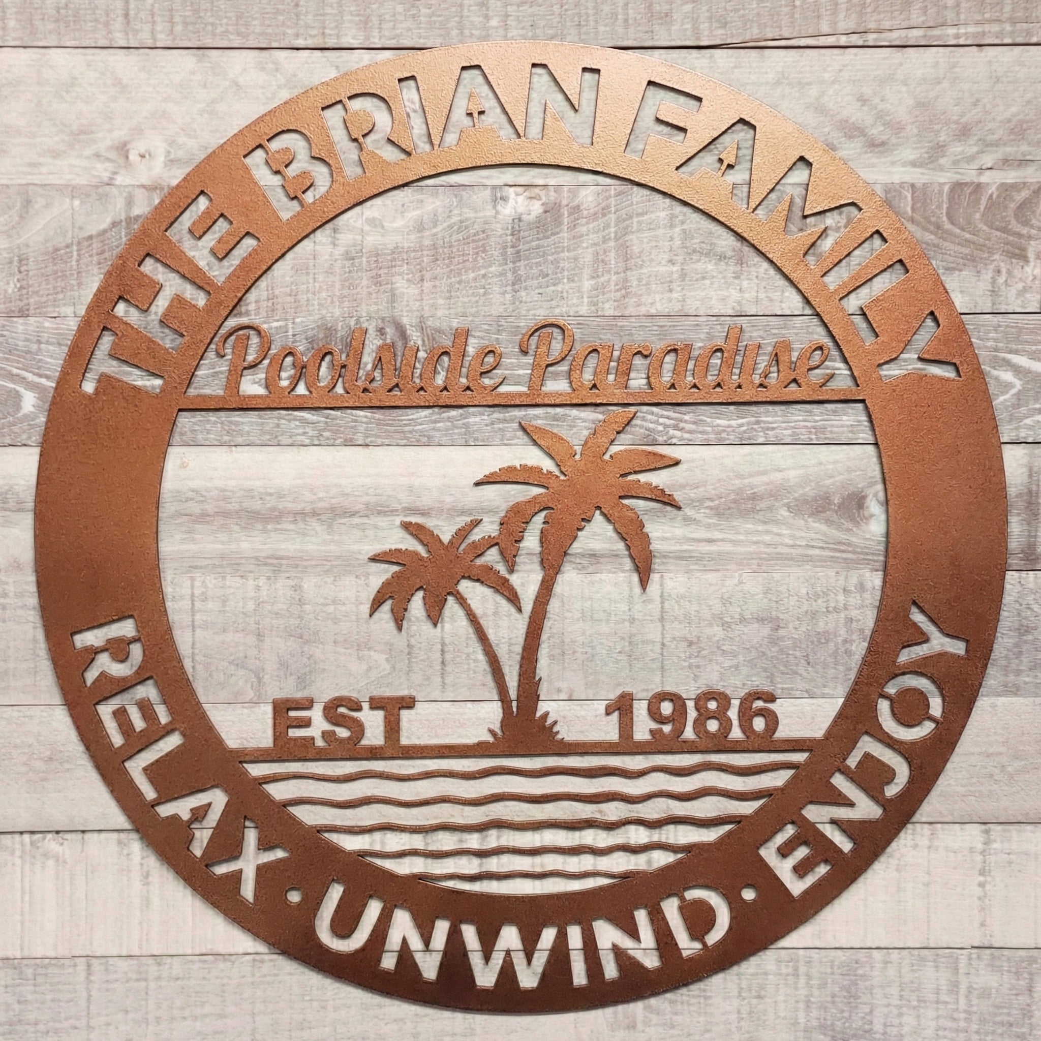 Decorative metal sign for pool patio on a wooden background