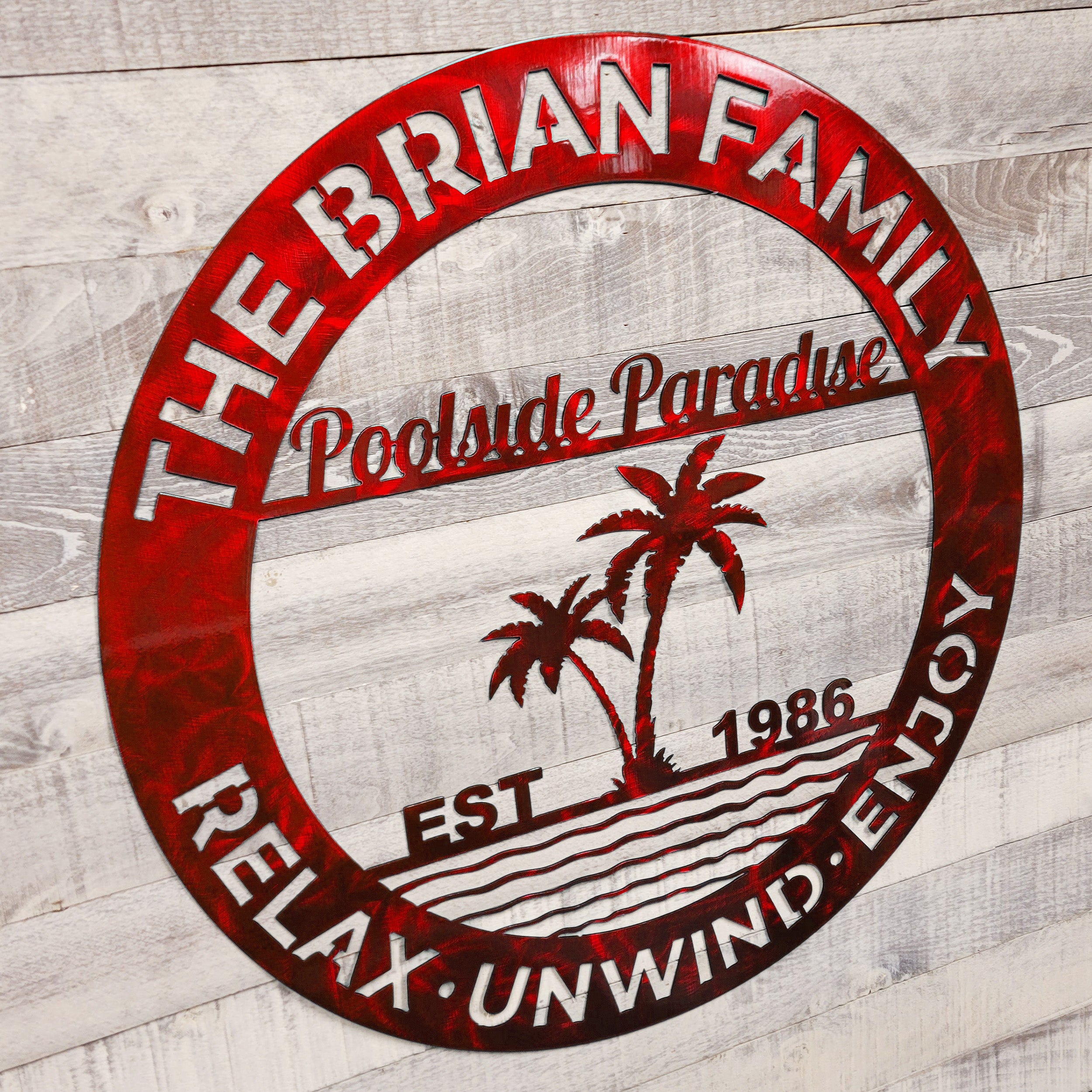 Circular metal sign for a pool patio on a wooden background