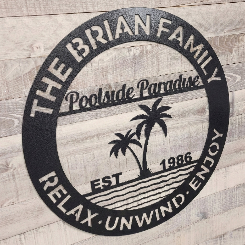 Decorative metal wall art for a pool patio on a wooden surface.
