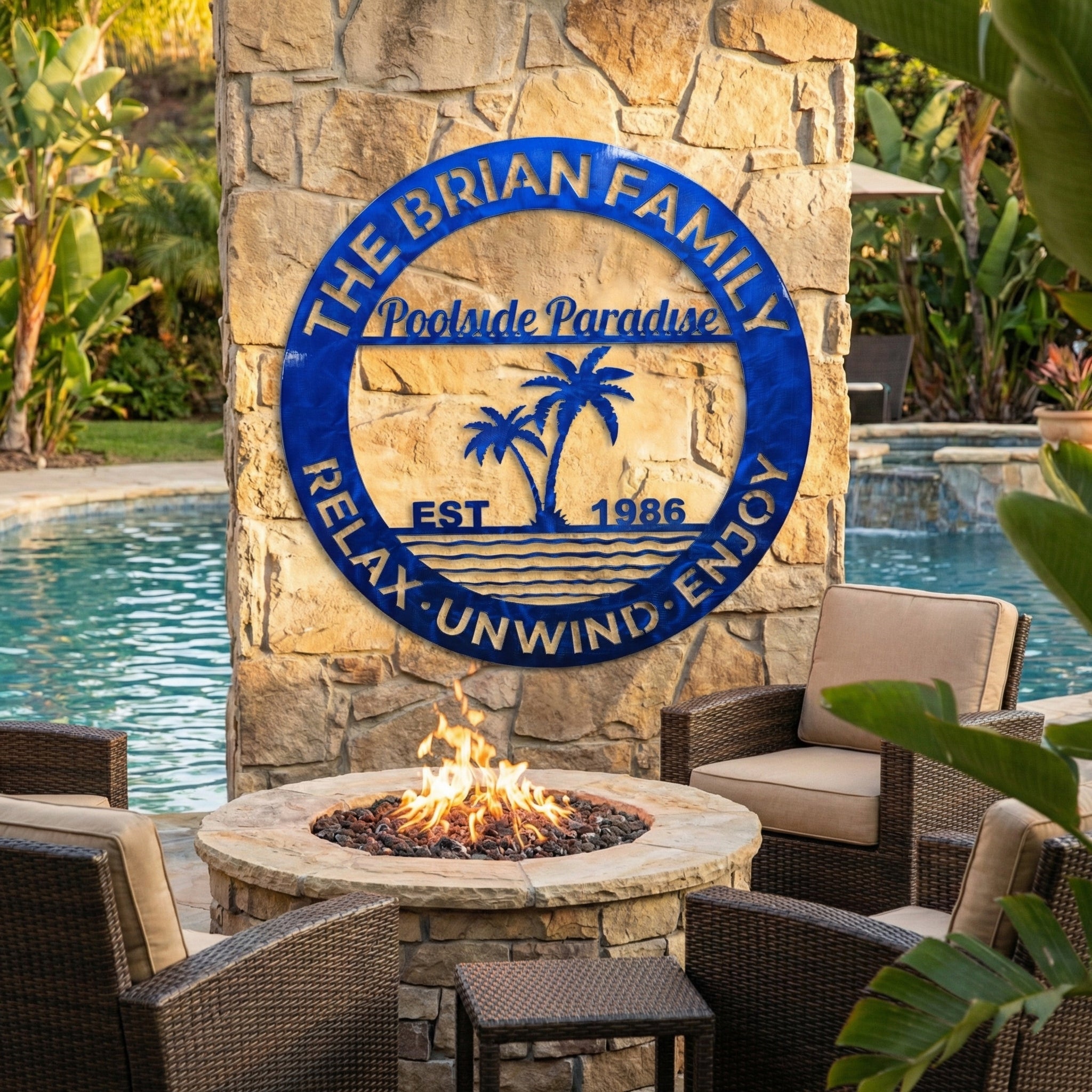 Fire pit area with poolside paradise sign, chairs, and pool in the background.