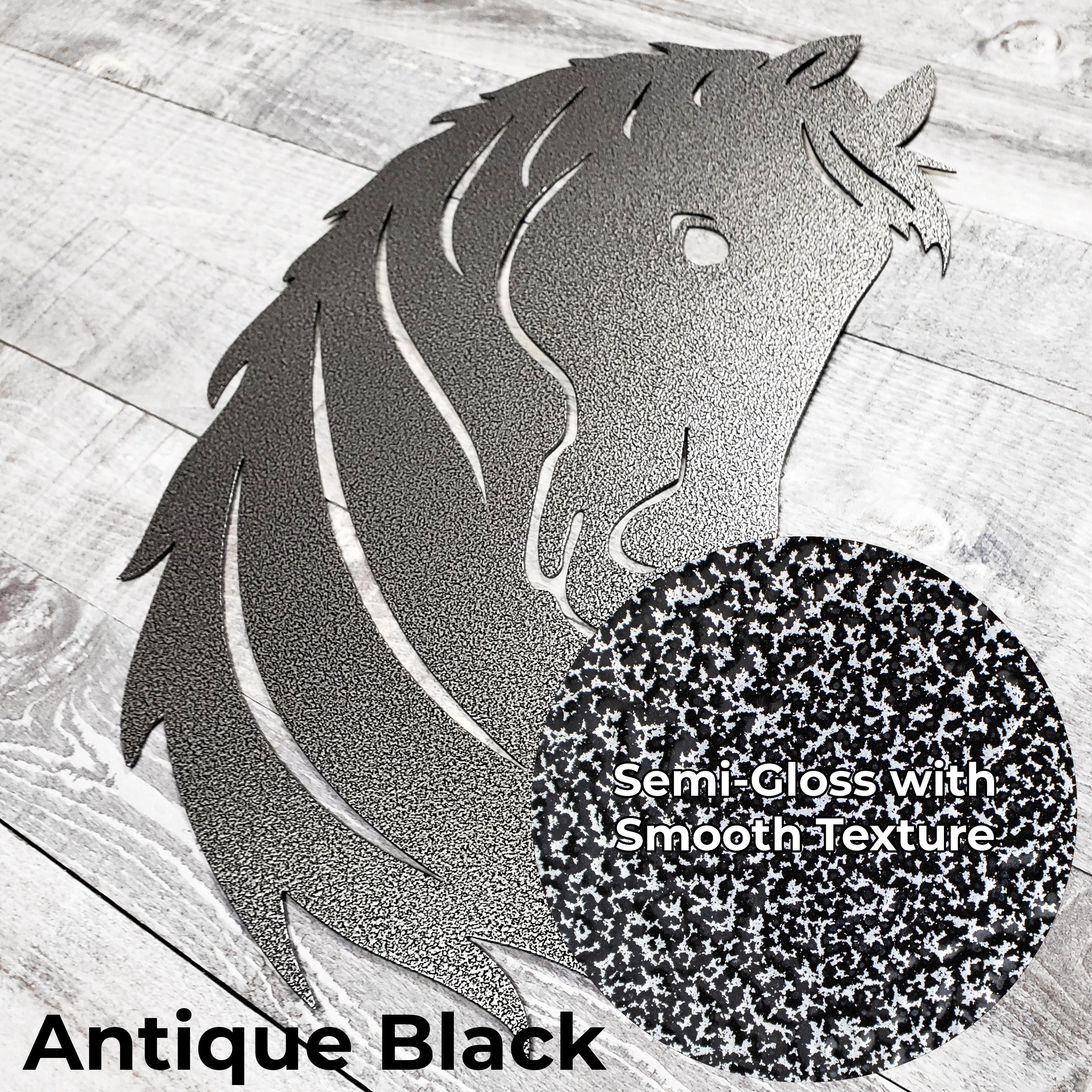 Black and silver metal horse head wall art on a wooden surface with close-up of 