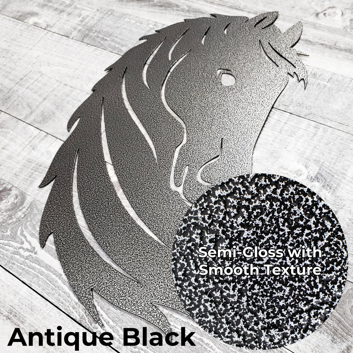 Black and silver metal horse head wall art on a wooden surface with close-up of 