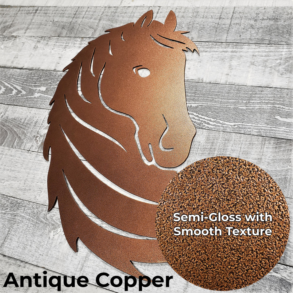 Metallic horse head wall art in antique copper color finish on a wooden surface