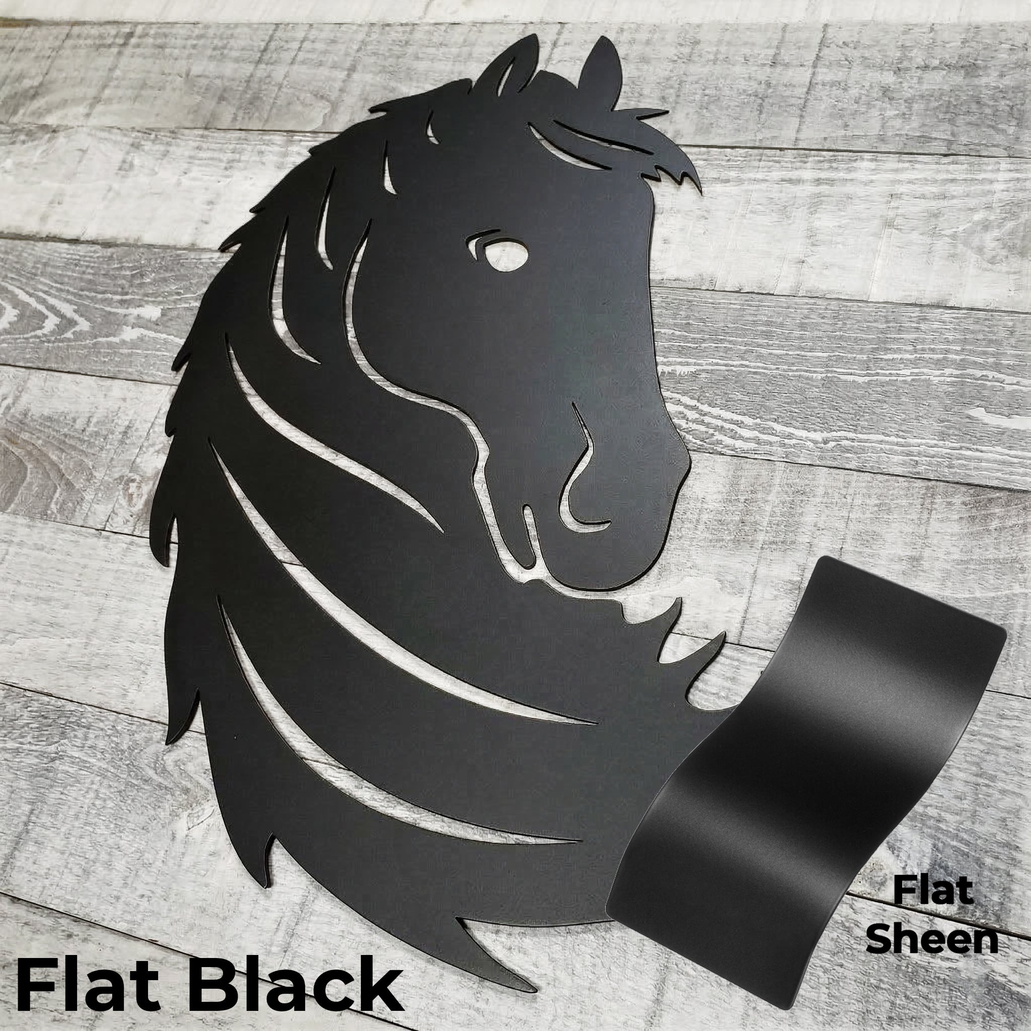 Black metal horse head wall art on a wooden surface with color panel