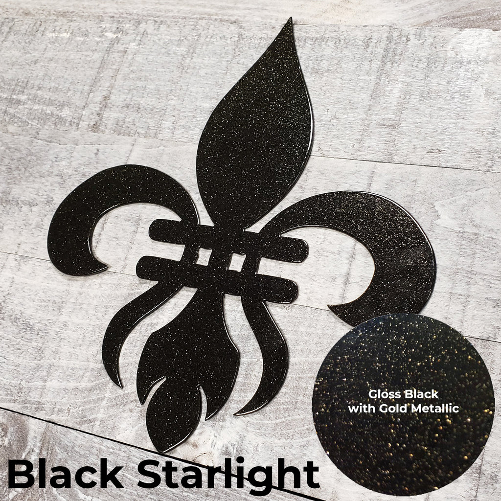 Decorative black metal fleur-de-lis on a wooden background with a close-up panel of the color finish