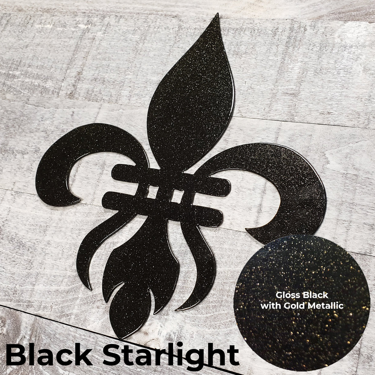 Decorative black metal fleur-de-lis on a wooden background with a close-up panel of the color finish