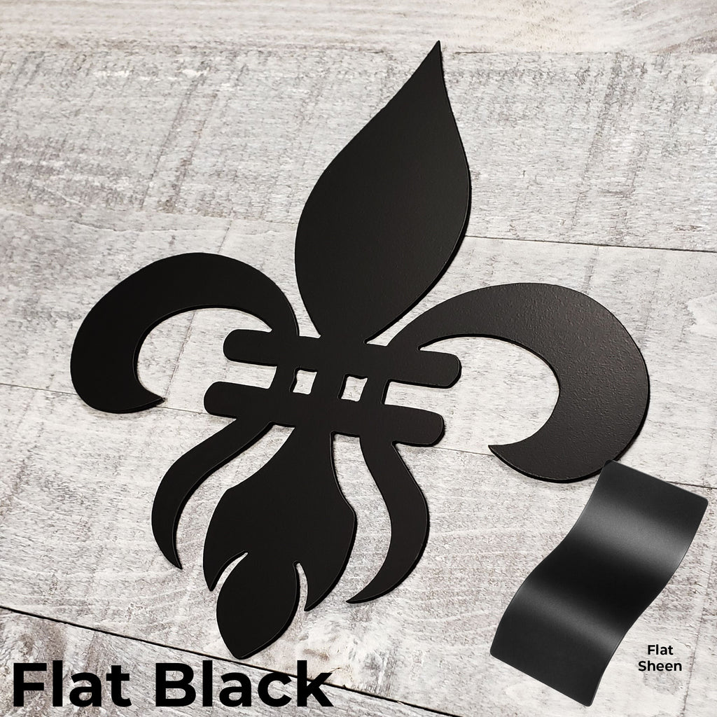Decorative black metal fleur-de-lis on a wooden background with color panel