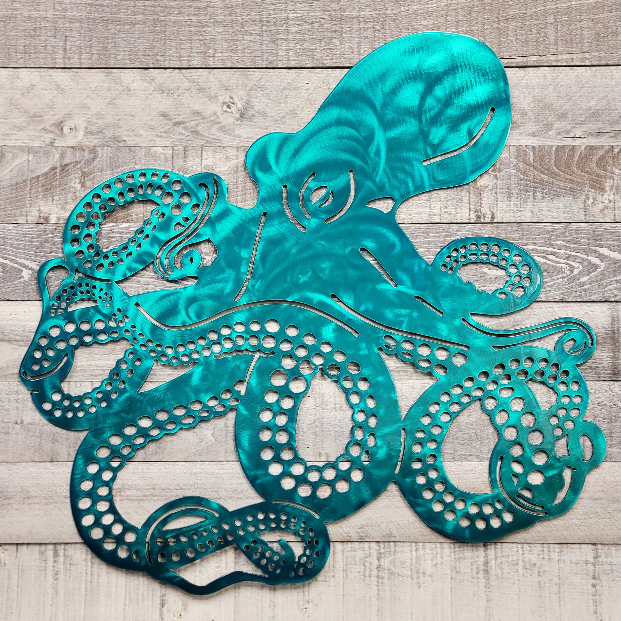 Metal octopus sculpture on a wooden surface