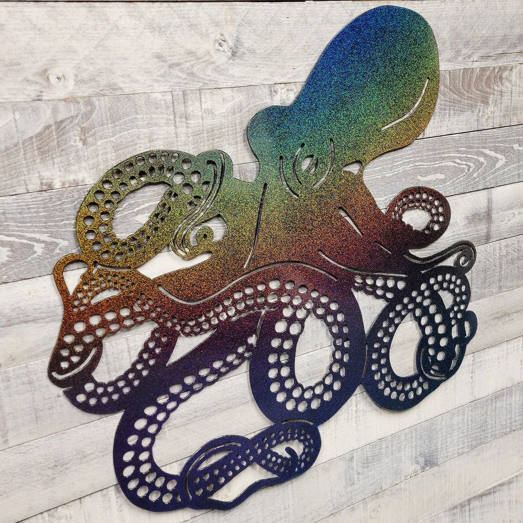octopus metal wall art with a rainbow finish on a wooden background