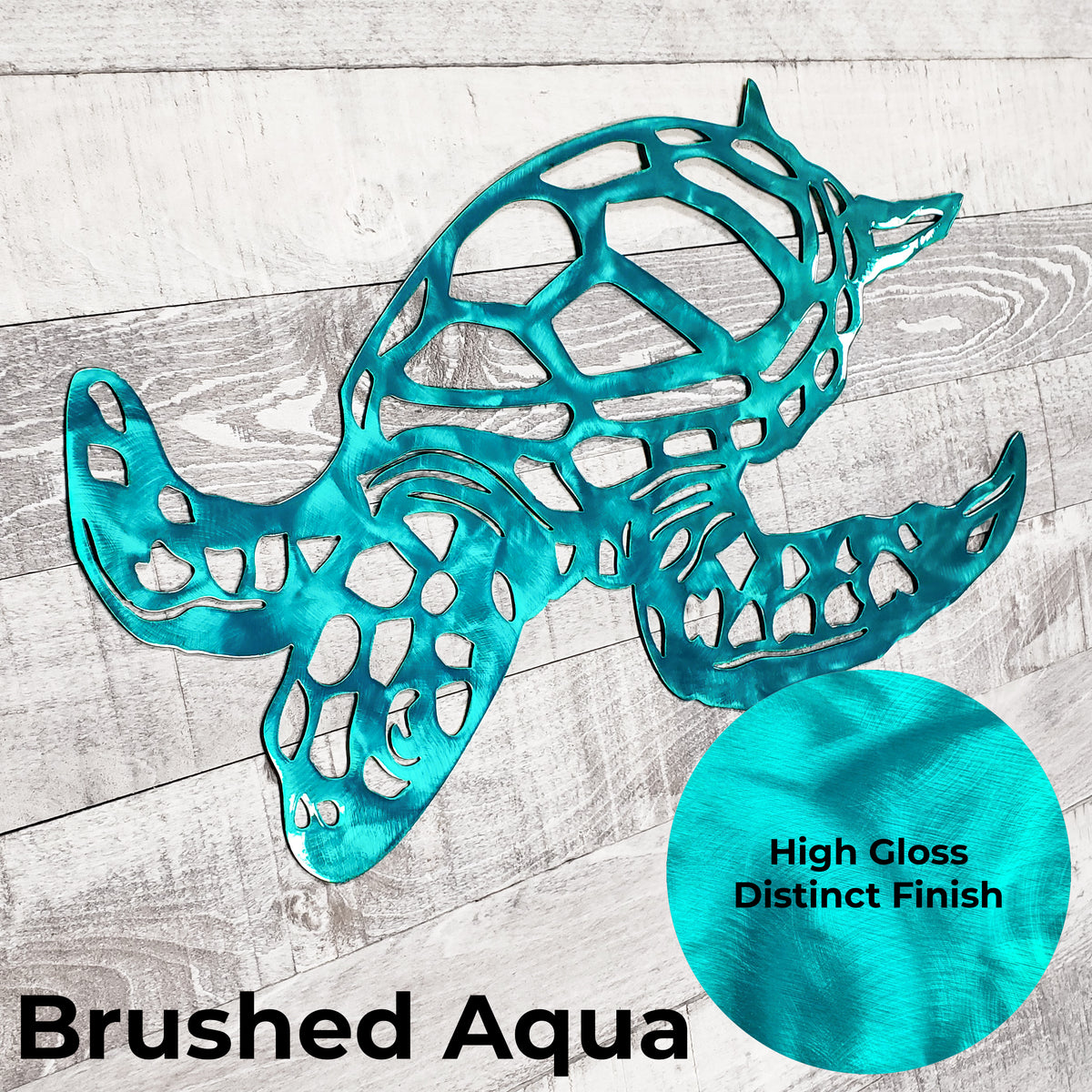 A turquoise/aqua metal turtle wall decor piece with an openwork geometric design, shown on a whitewashed wood background. A circular inset highlights the high-gloss brushed finish, and the text 'Brushed Aqua' appears at the bottom.