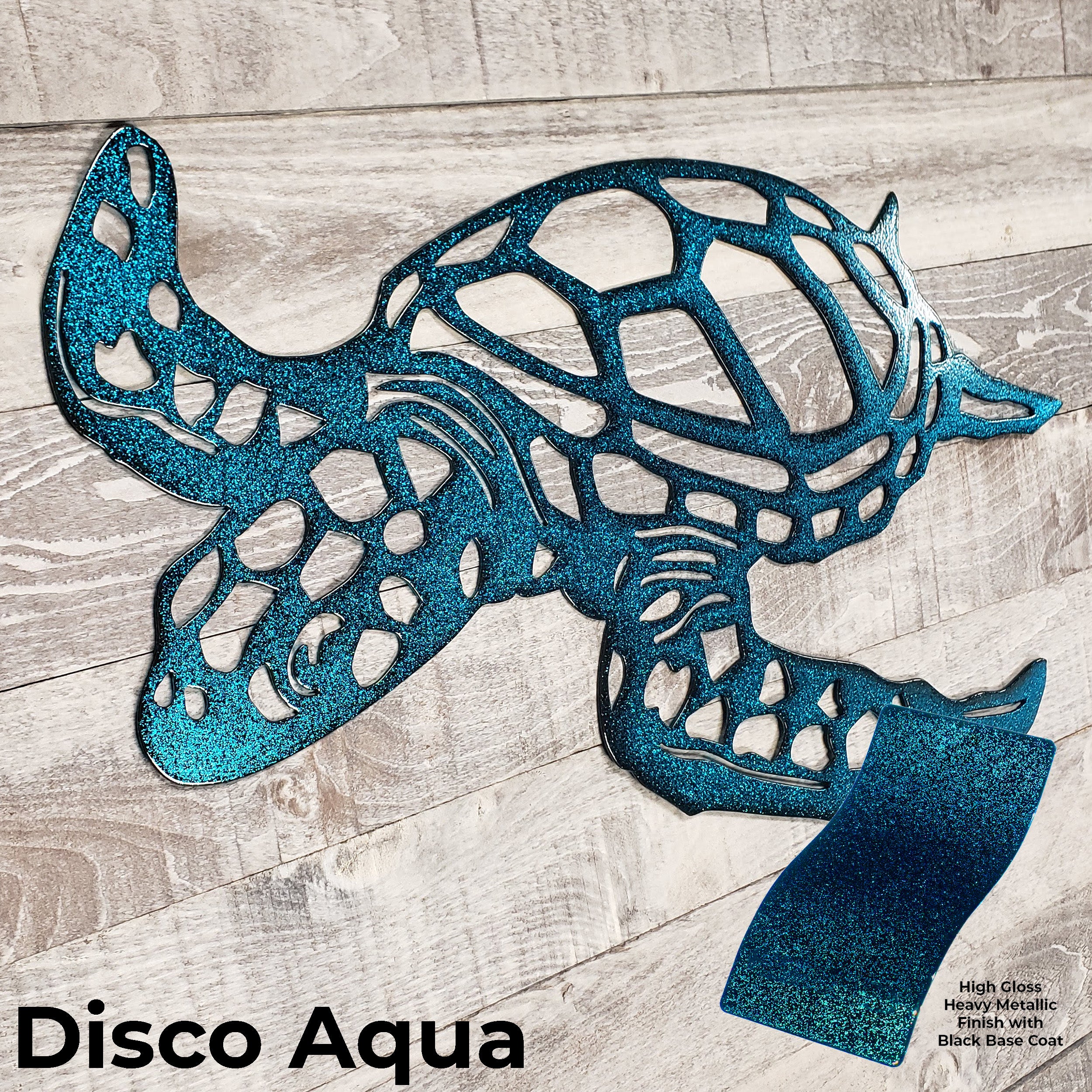 Metallic blue sea turtle sculpture on a wooden surface with 'Disco Aqua' text.