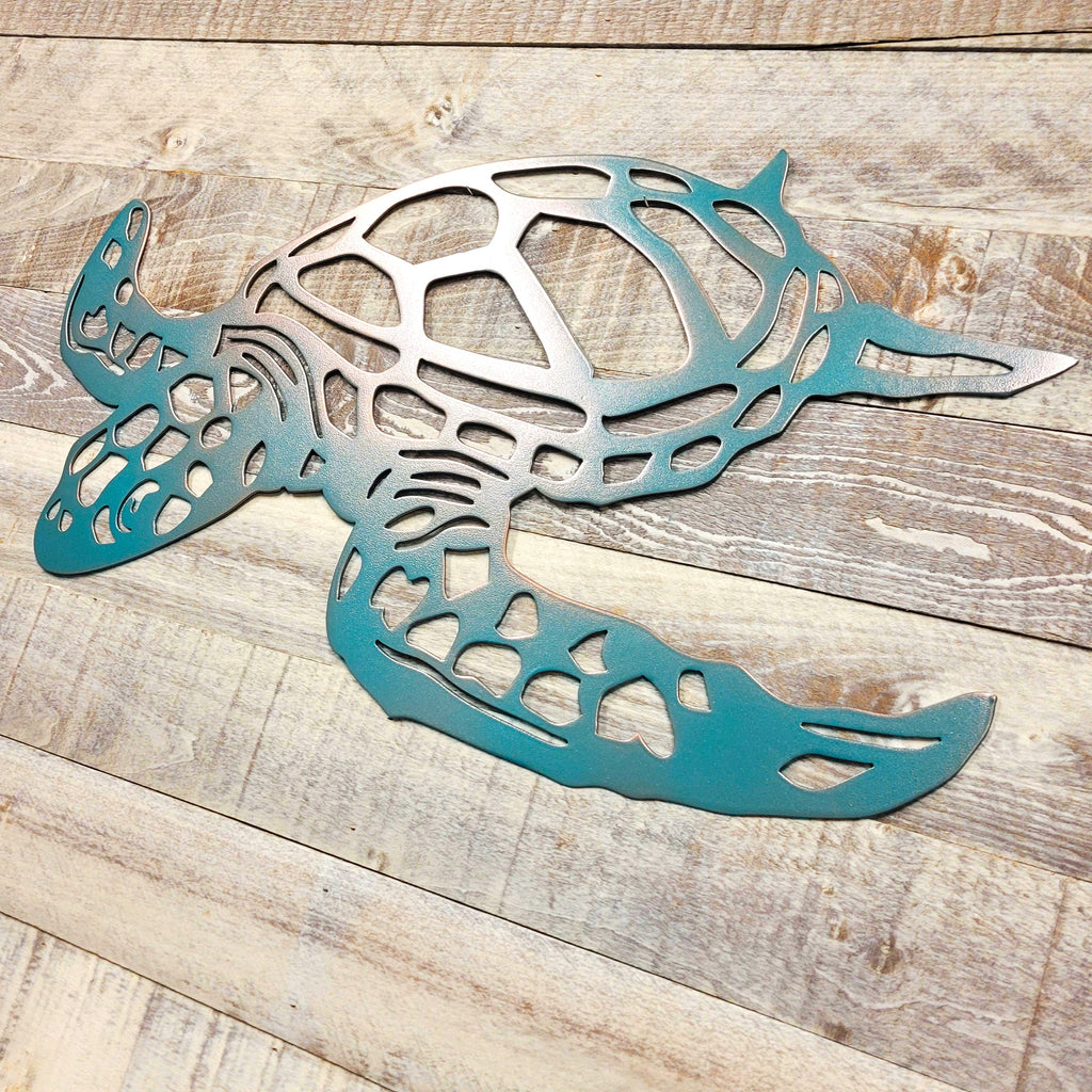 Metal turtle sculpture on a wooden surface