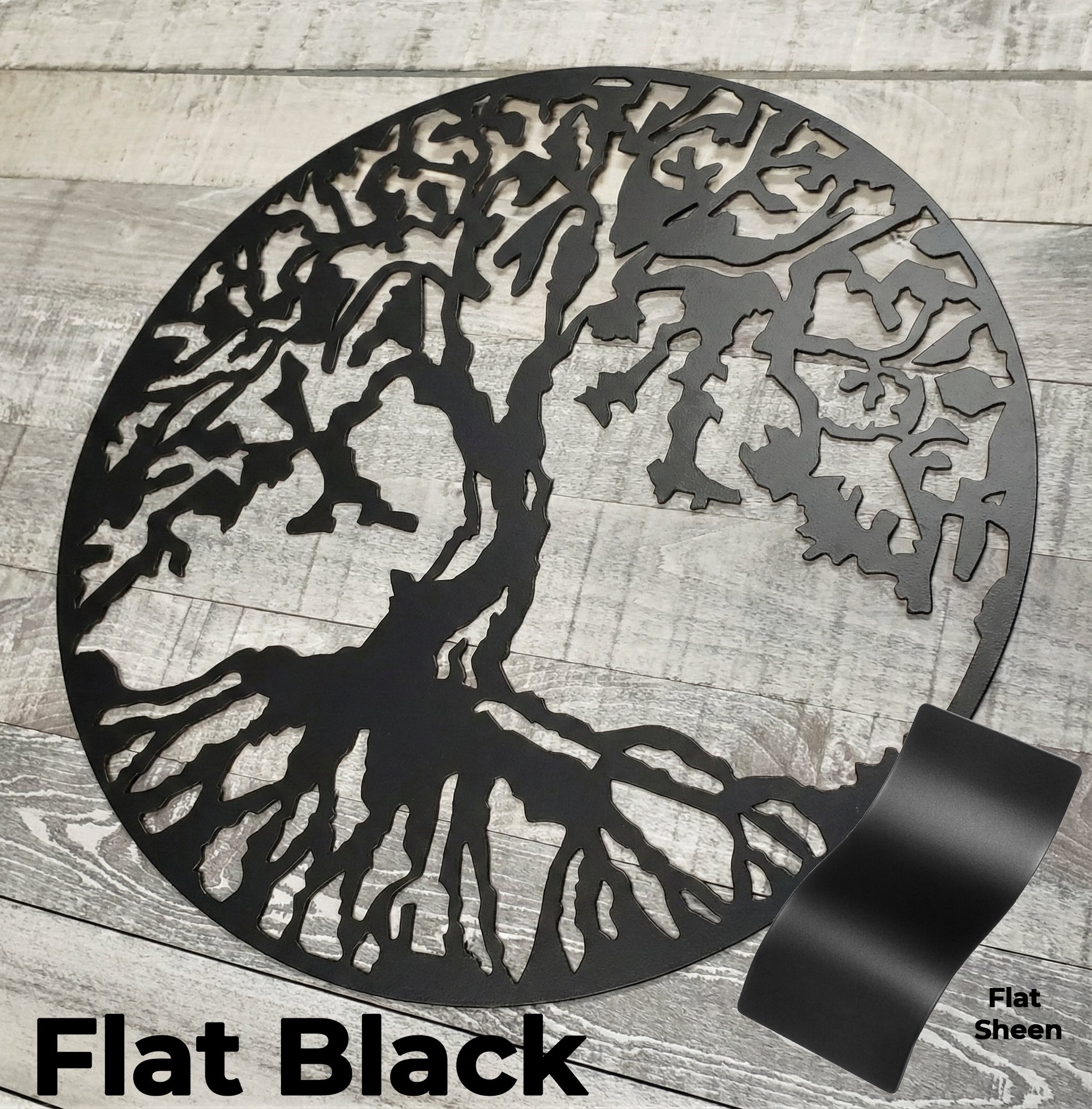 Black metal tree design on a wooden surface with 'Flat Black' text.