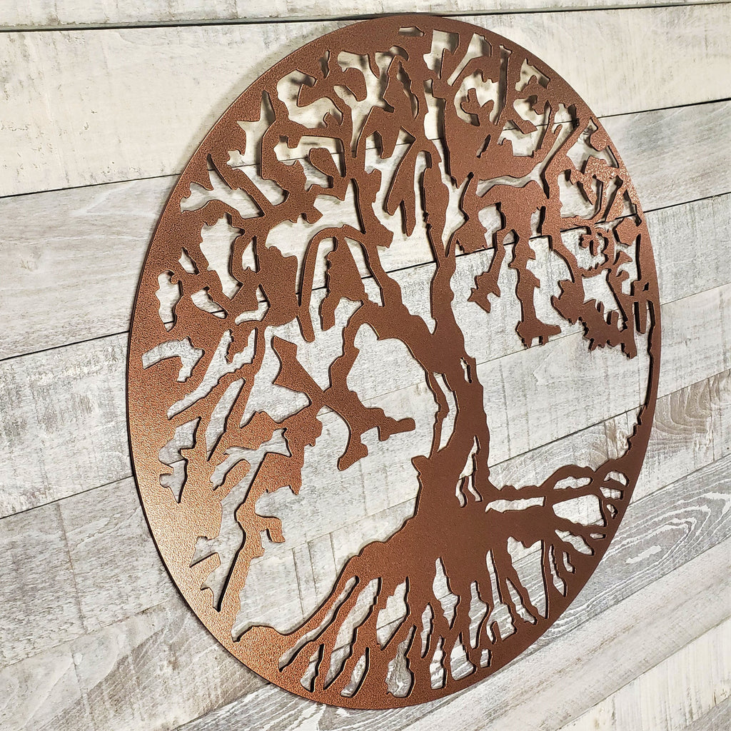 Decorative metal tree wall art on a wooden background