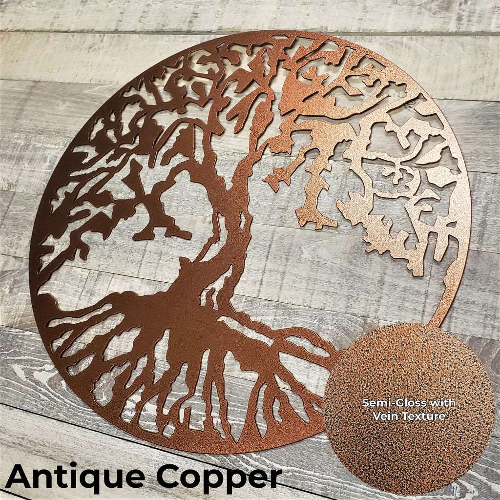 Decorative metal tree wall art in antique copper on a wooden surface
