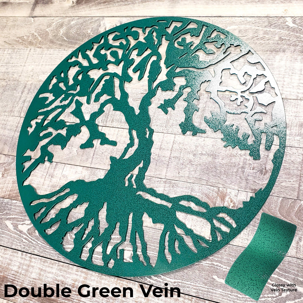 Decorative metal tree wall art with 'Double Green Vein' finish on a wooden surface.