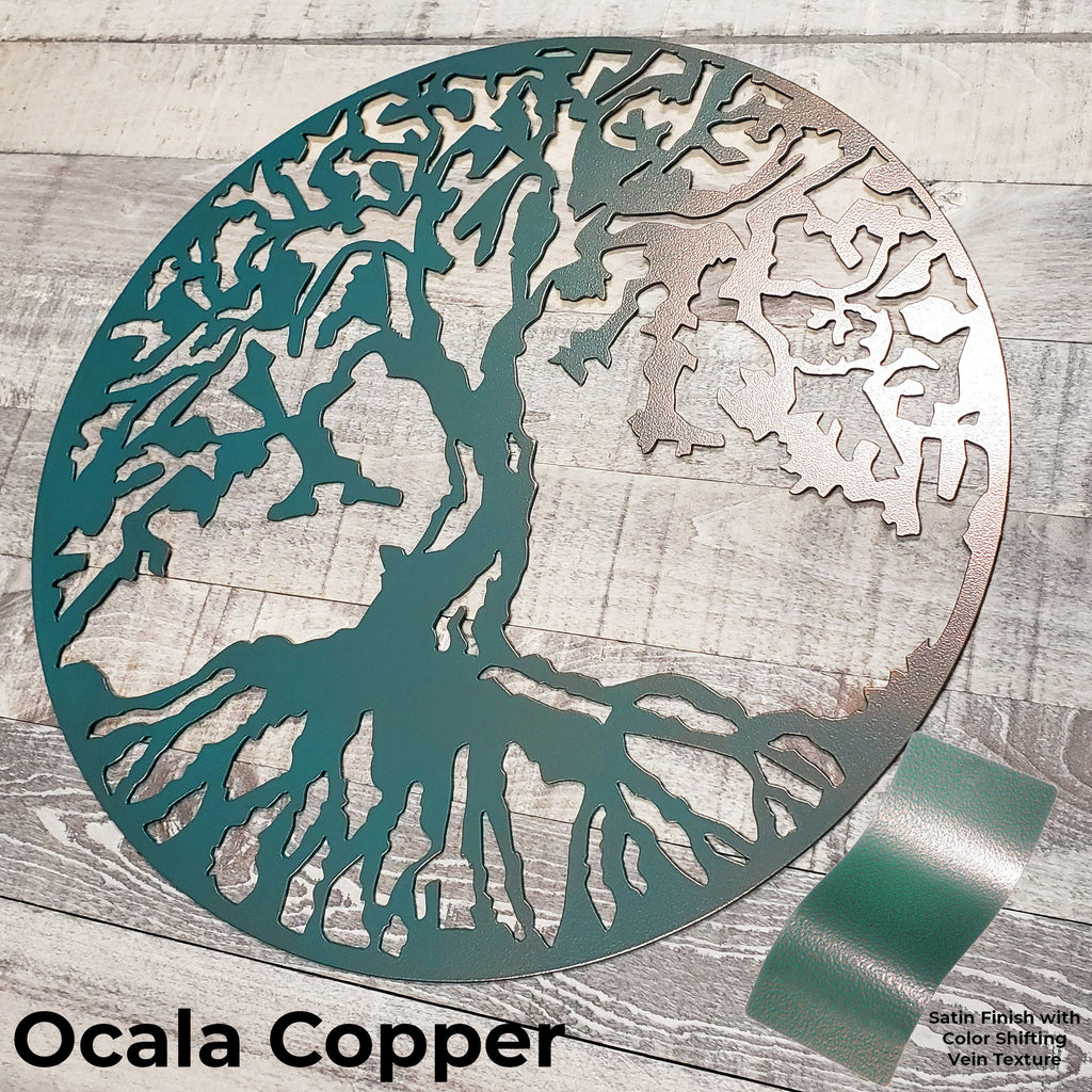 Decorative metal tree wall art with 'Ocala Copper' finish on a wooden surface.
