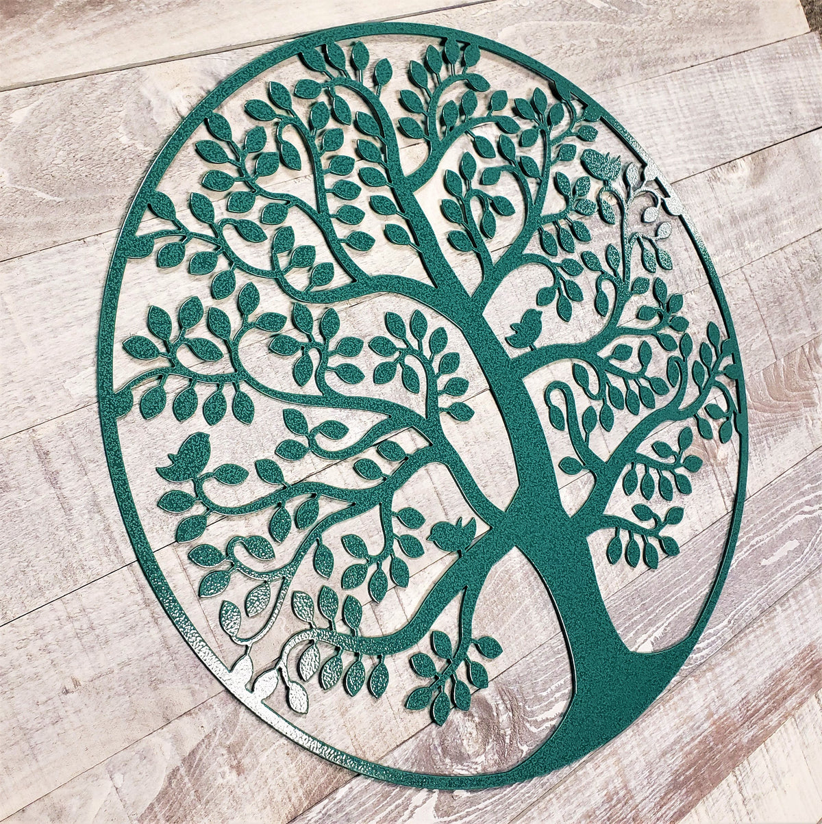 Decorative metal tree design on a wooden floor