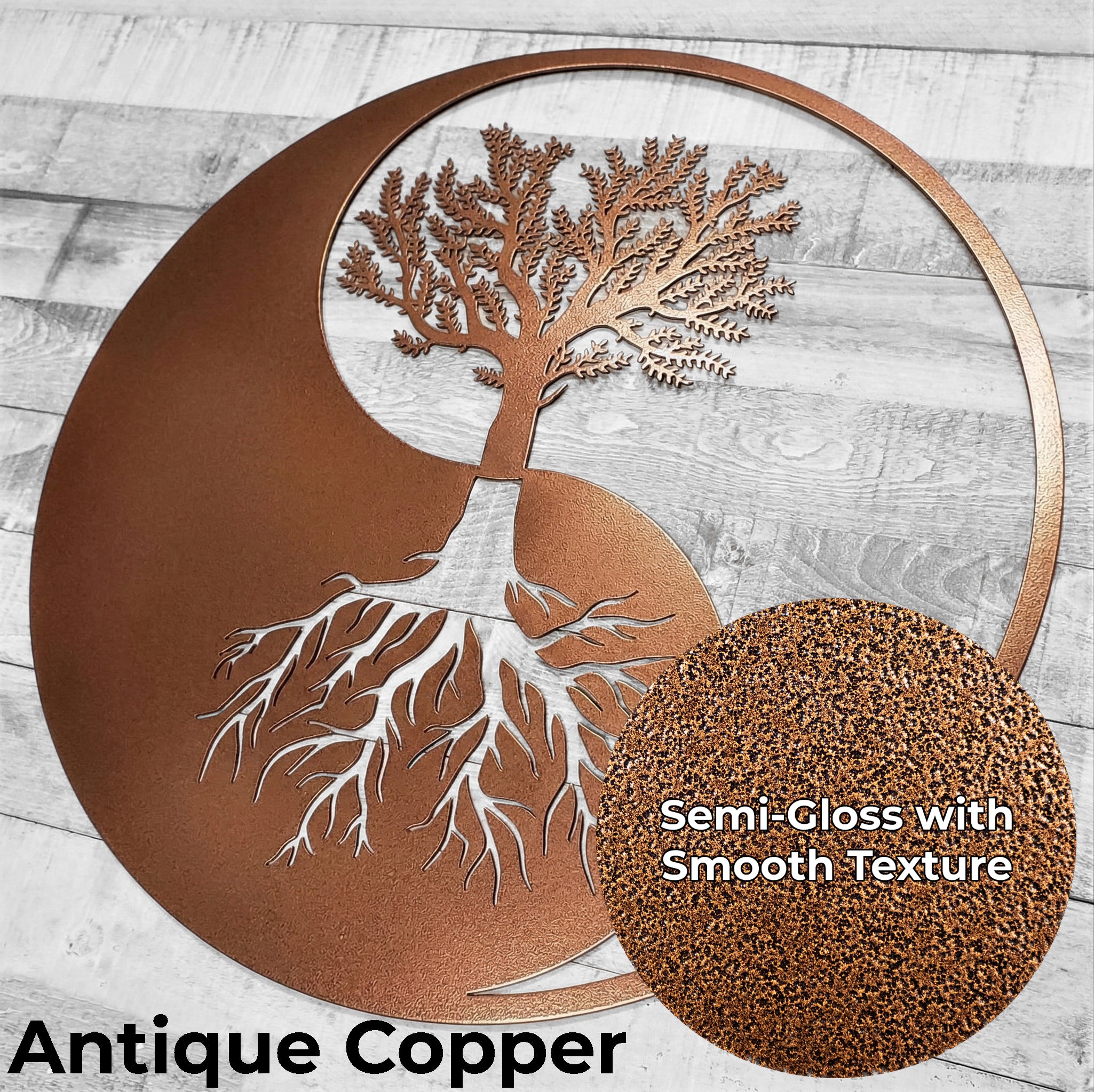 Decorative wall art with tree design in antique copper on a wooden surface.