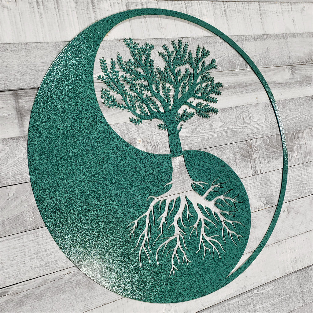 Yin yang symbol with a tree inside on a wooden background